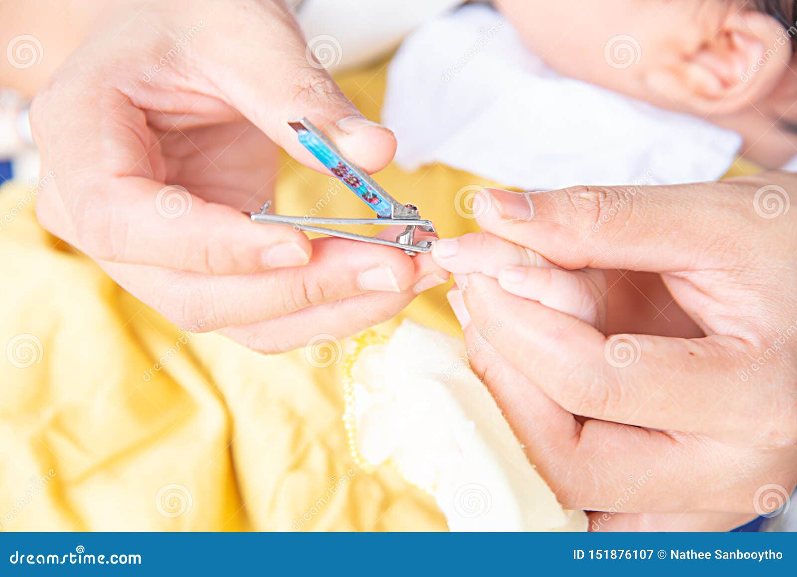 Mother Cutting Babies Nails Stock Image - Image of blue, finger: 151876107