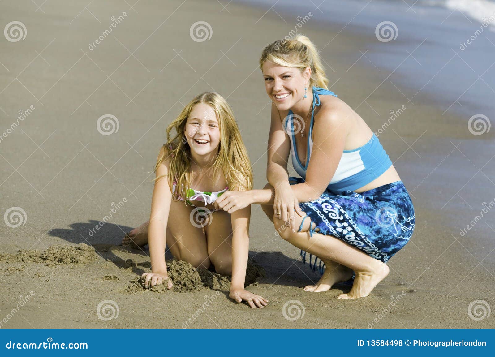 Mother and Daughter on Beach Stock Photo - Image of females, clothing
