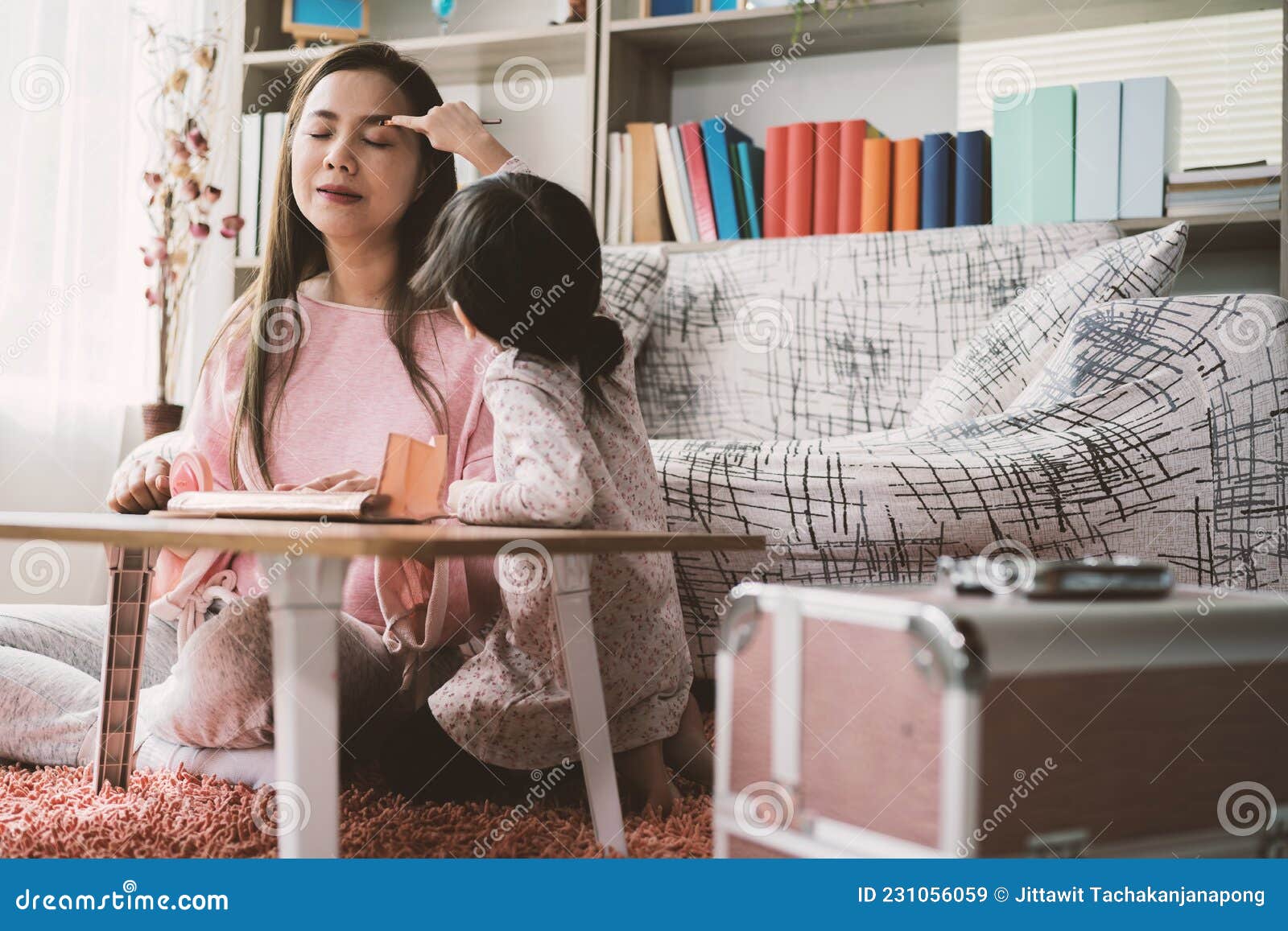 Mother And Daughter Doing Makeup Sitting On The Floor In The Bedroom Mothers Day Stock Image