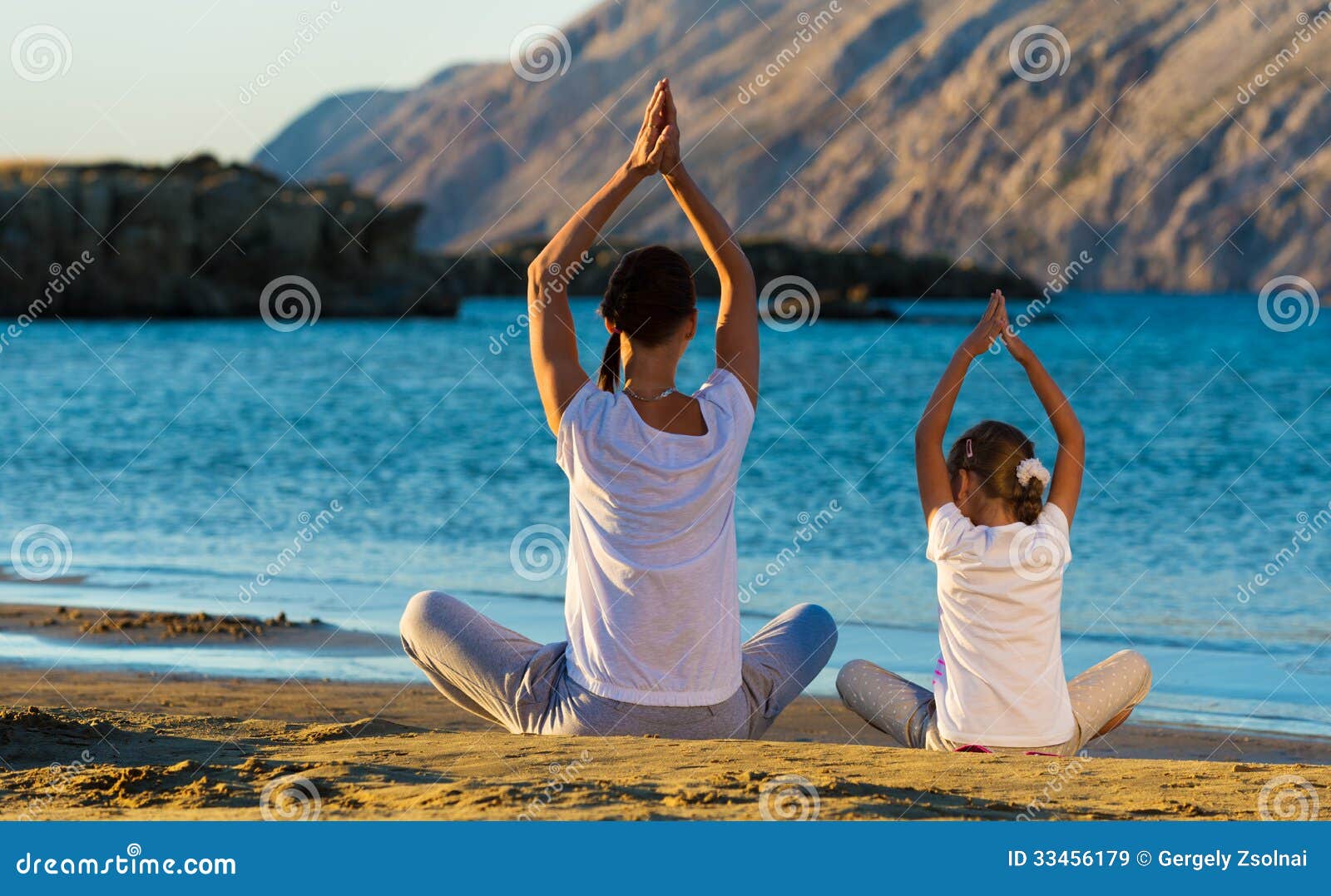 Mother and Daughter Doing Yoga Exercise on the Beach Stock Image - Image of  lifestyle, body: 33456179