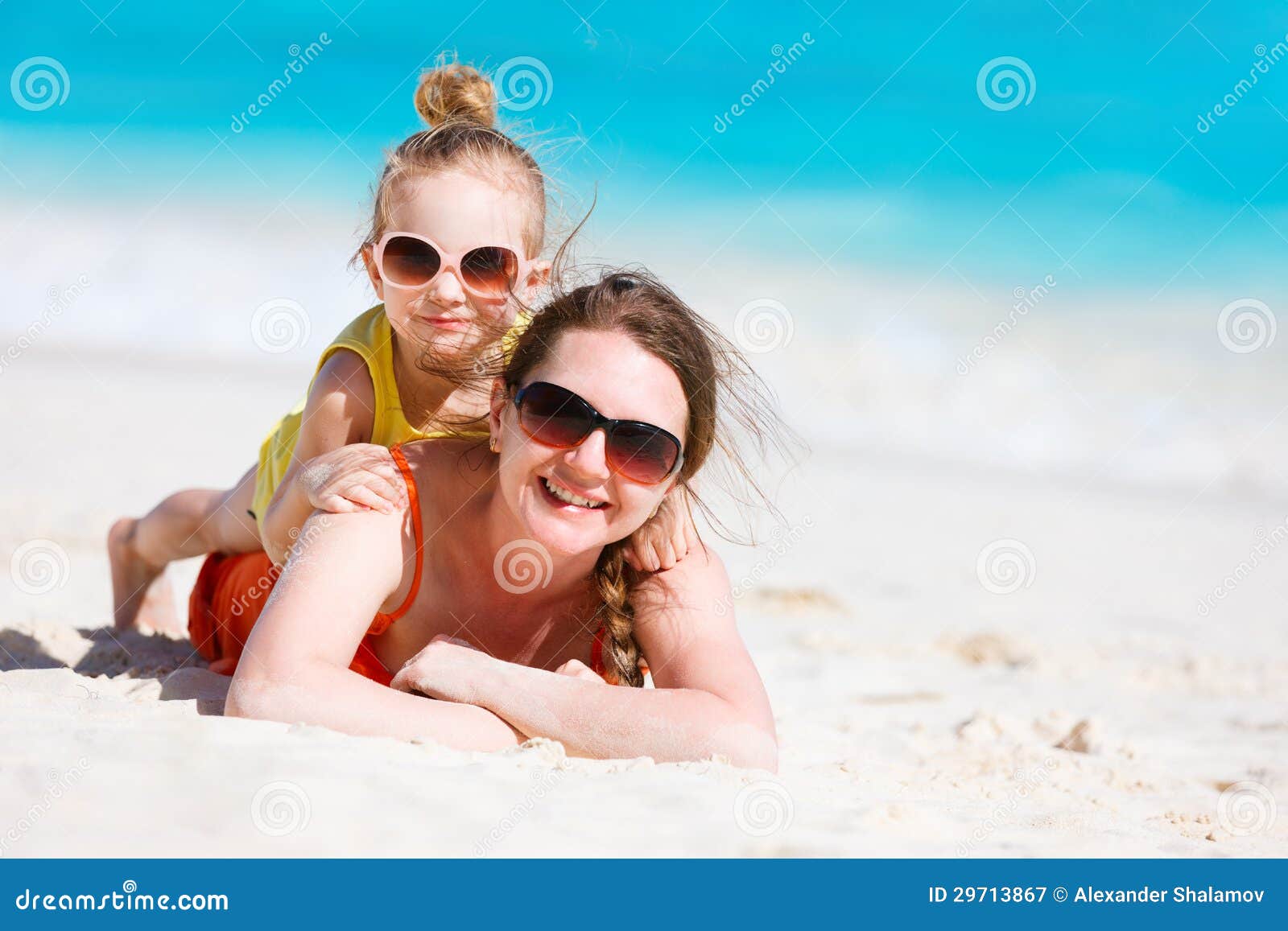 Mother And Daughter At Beach Stock Image - Image of parenting, parent