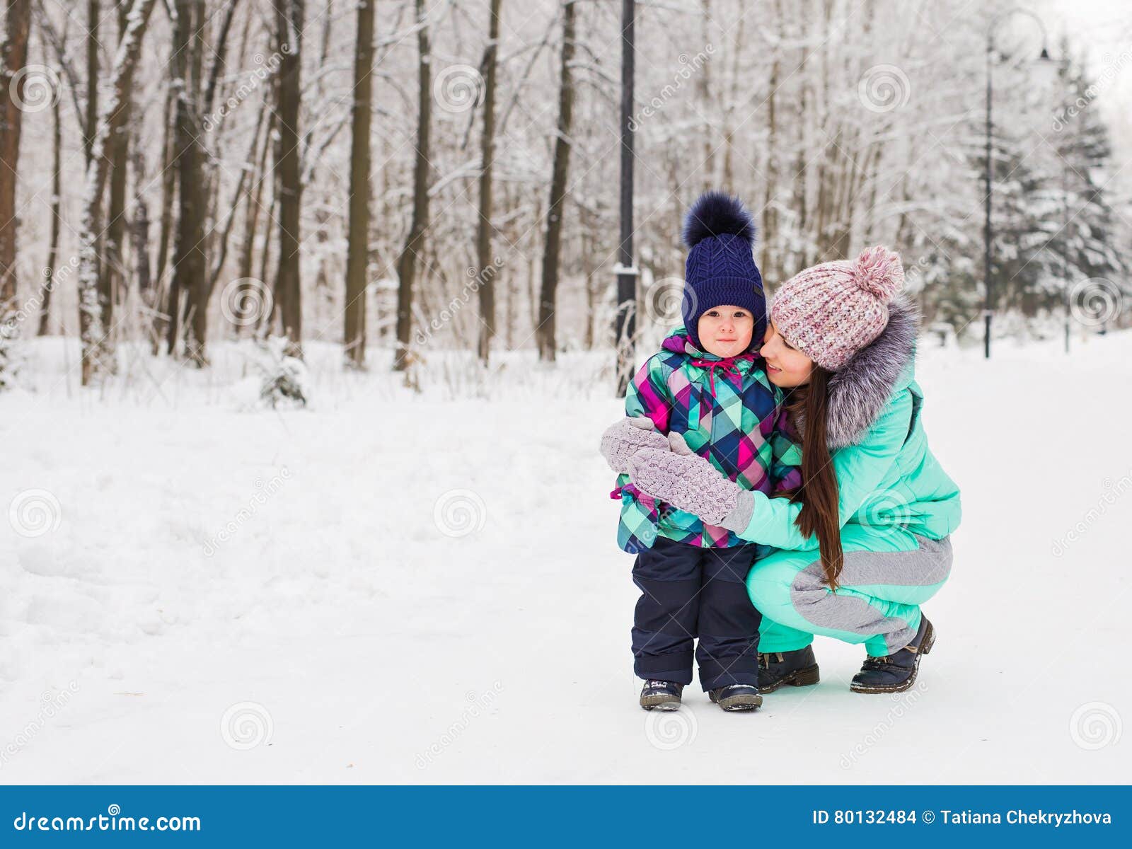 Mother and Daughter Having Fun in the Winter Park Stock Photo Image