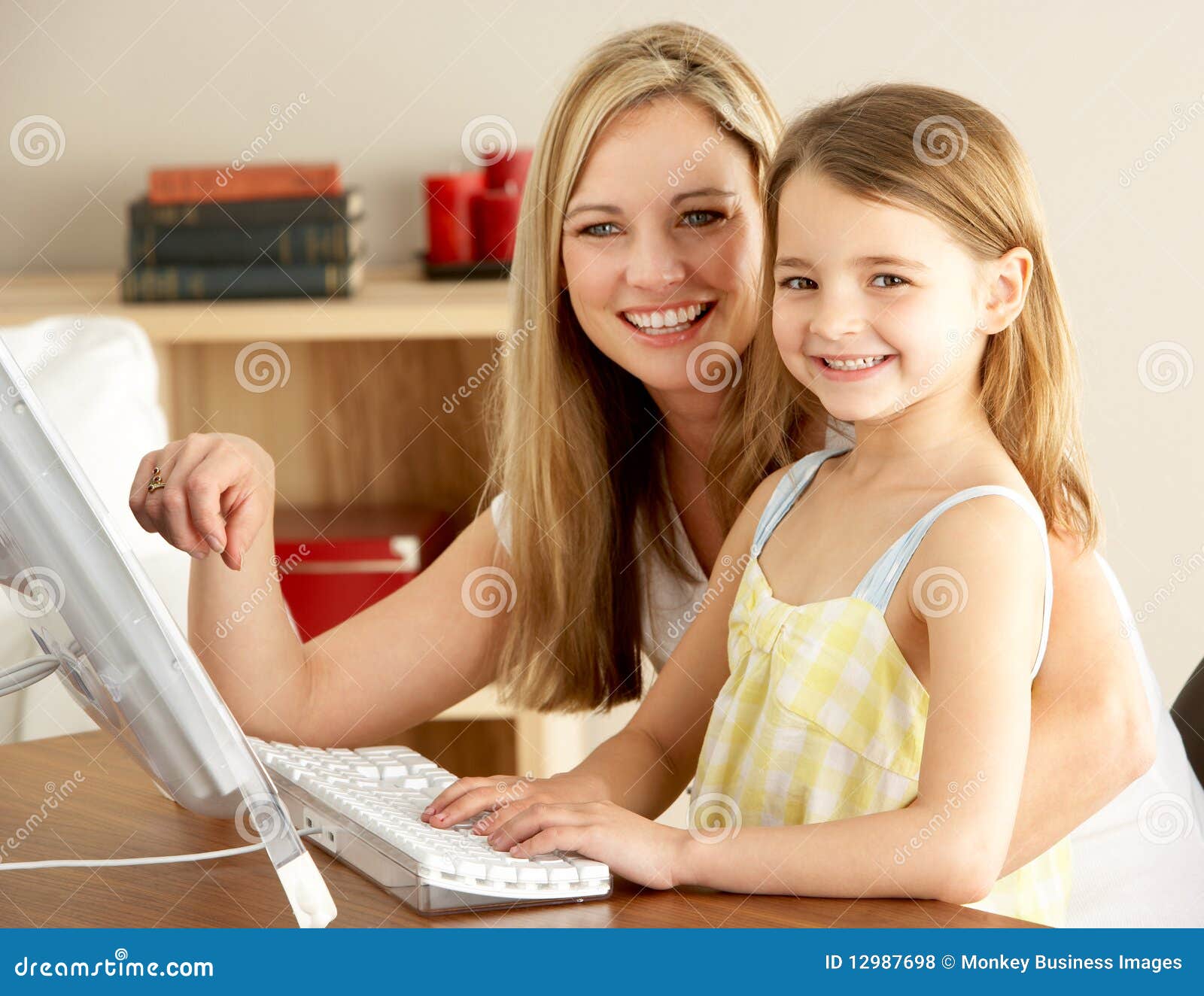 Mother And Daughter At Home Using Computer Royalty Free 