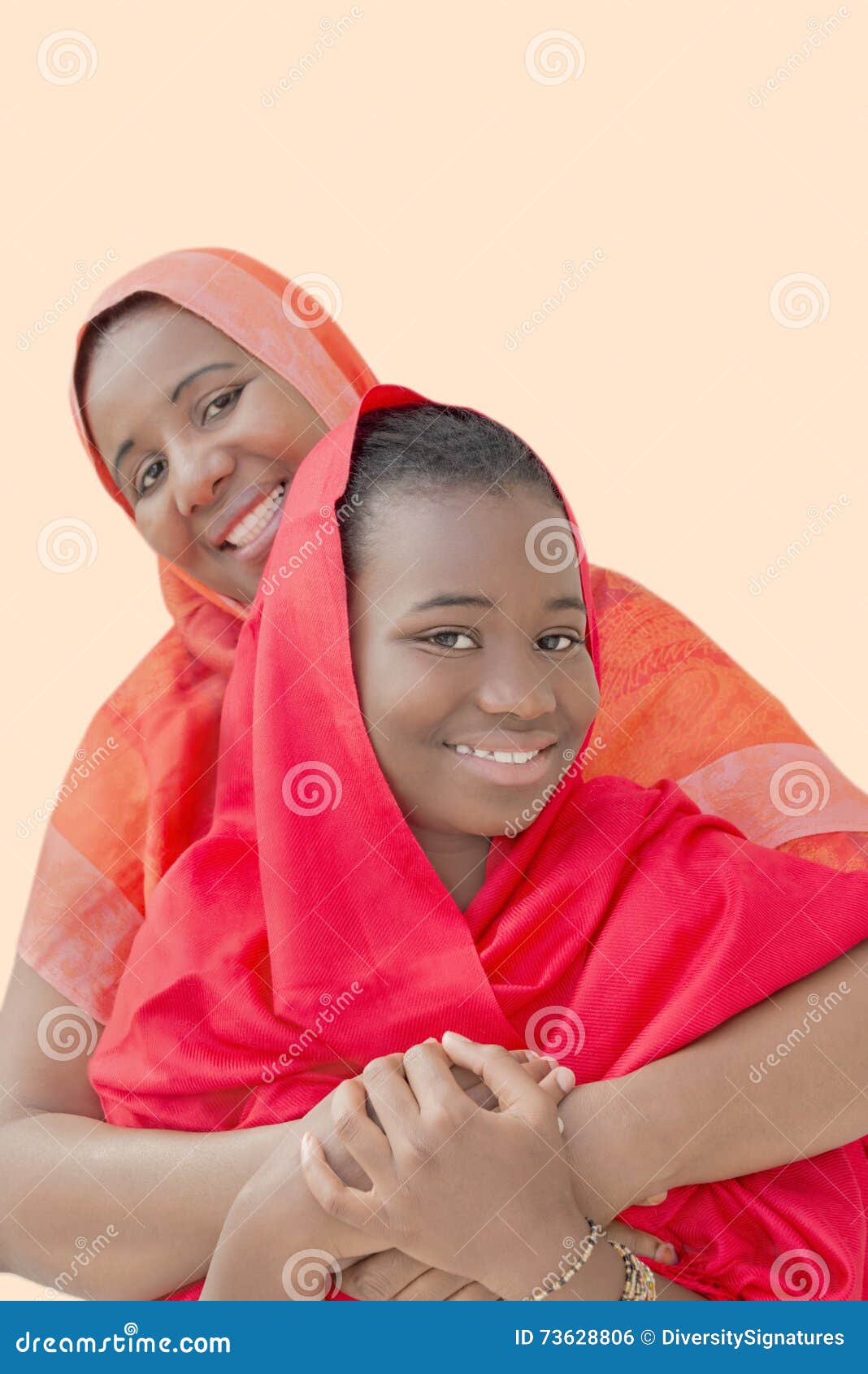 Mother And Daughter Hugging Each Other And Smiling 