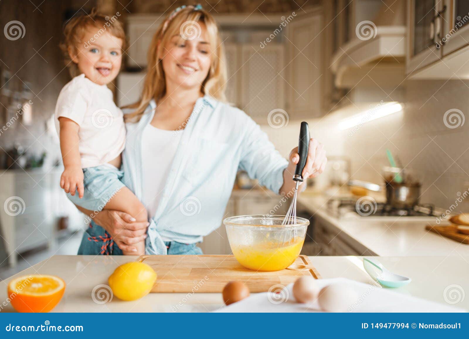 Download Mother And Daughter Mixing Ingredients For Cake Stock Photo - Image of fruit, child: 149477994