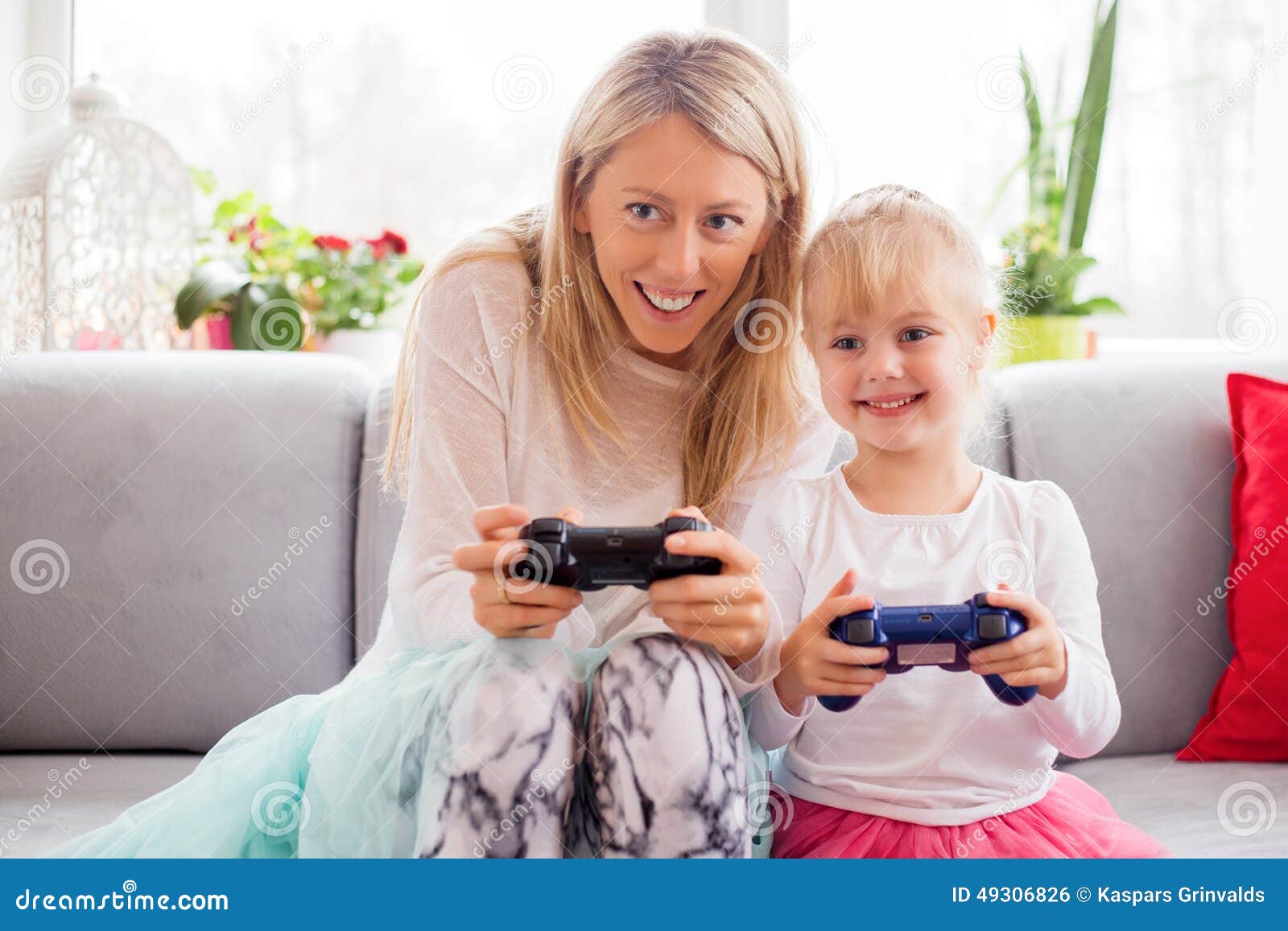 Mother and Daughter Playing Video Games in Bed Stock Photo Image of