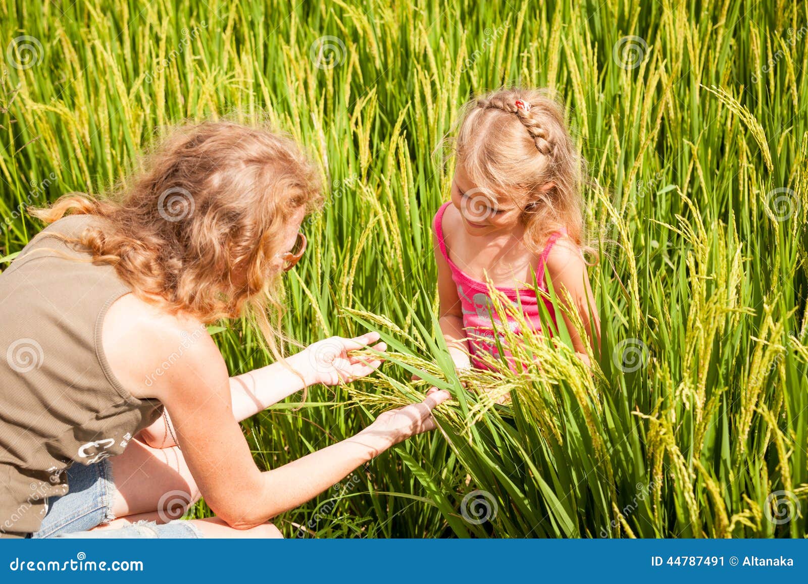 mother and daughter on the rice paddies