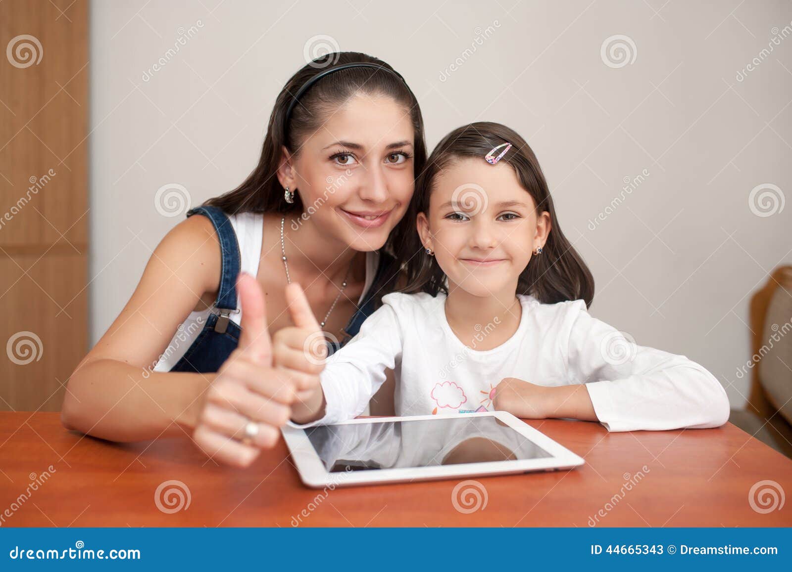 Mother and Daughter Showing Thumb Stock Image - Image of house, focus ...