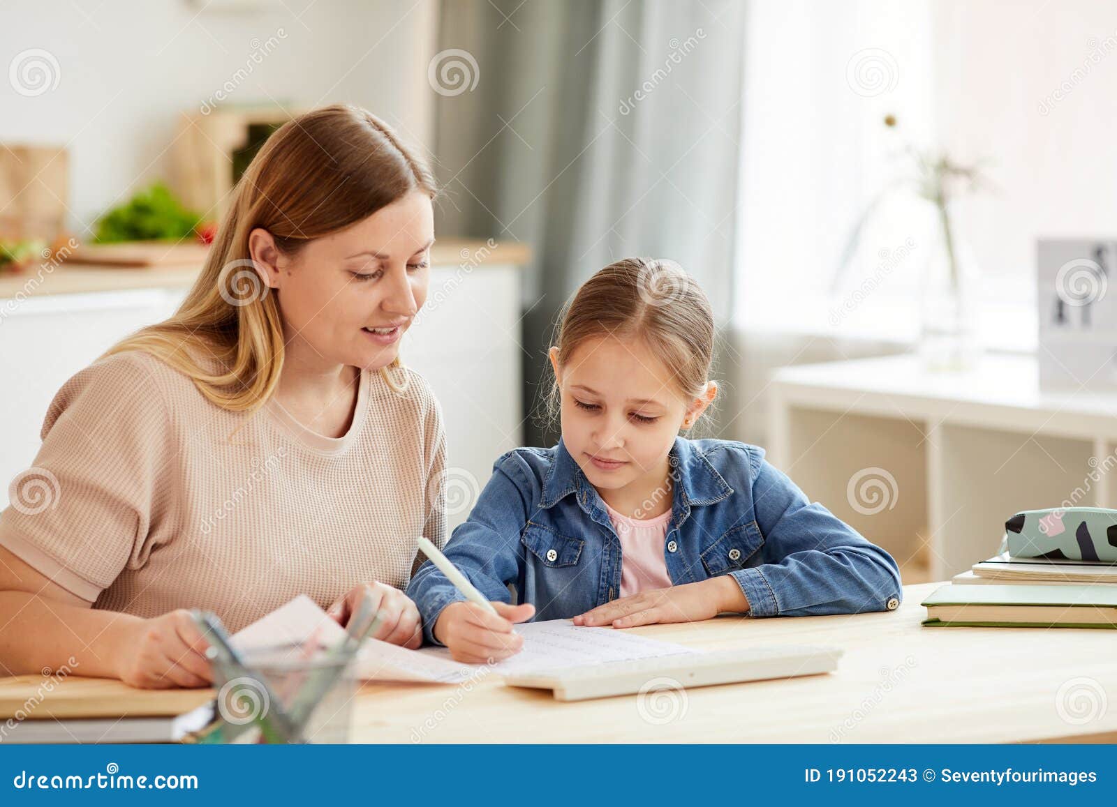 mother and daughter studying at home