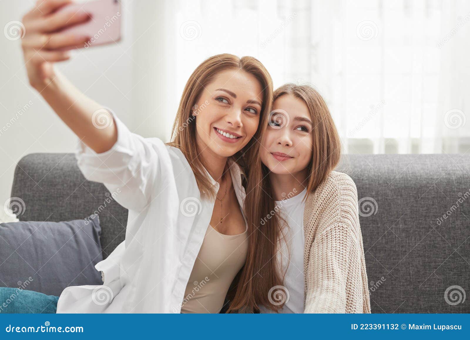 Mother and Daughter Taking Selfie at Home Stock Photo - Image of cuddle ...