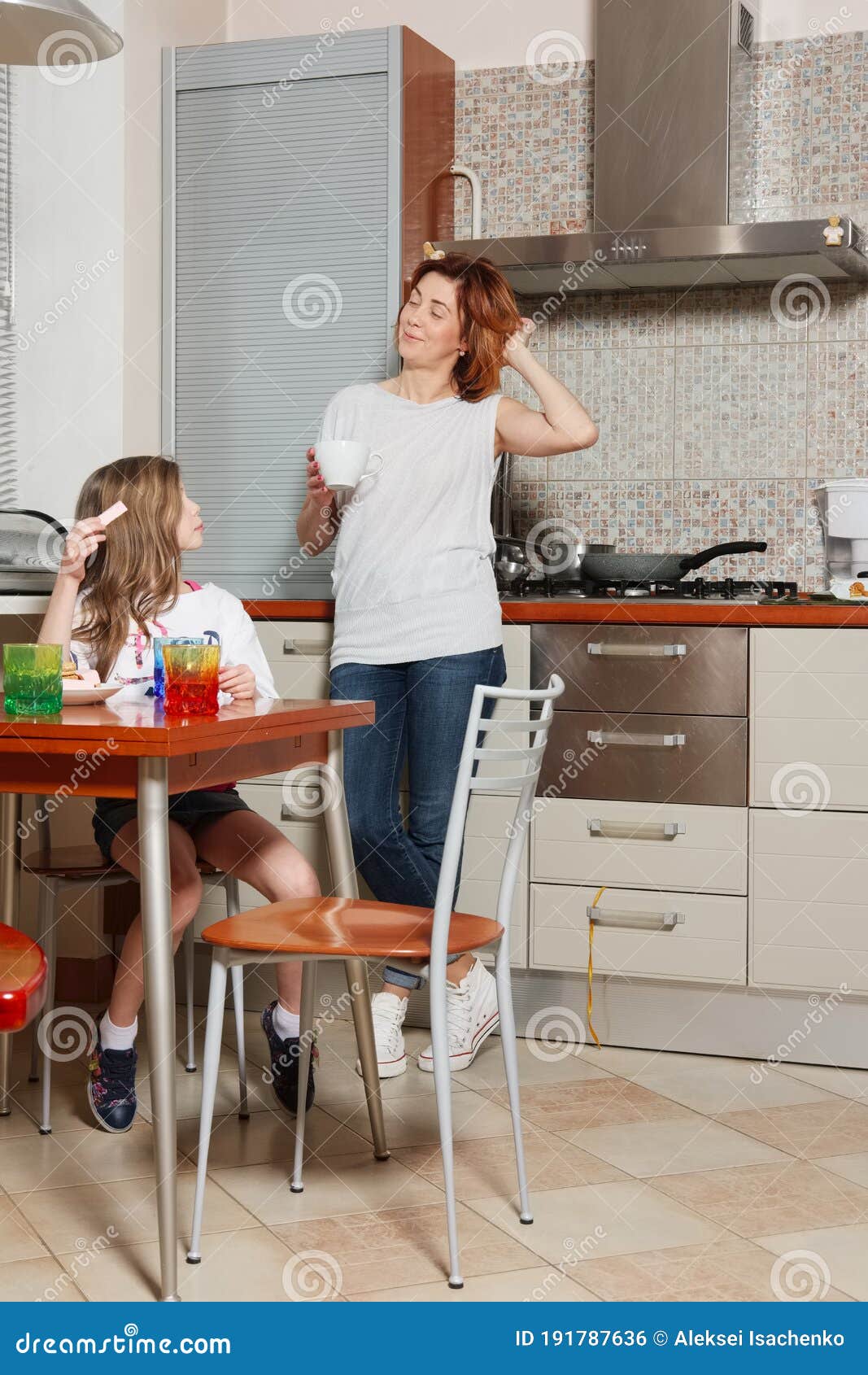 Mother and Daughter on the Kitchen Stock Photo Image of glass