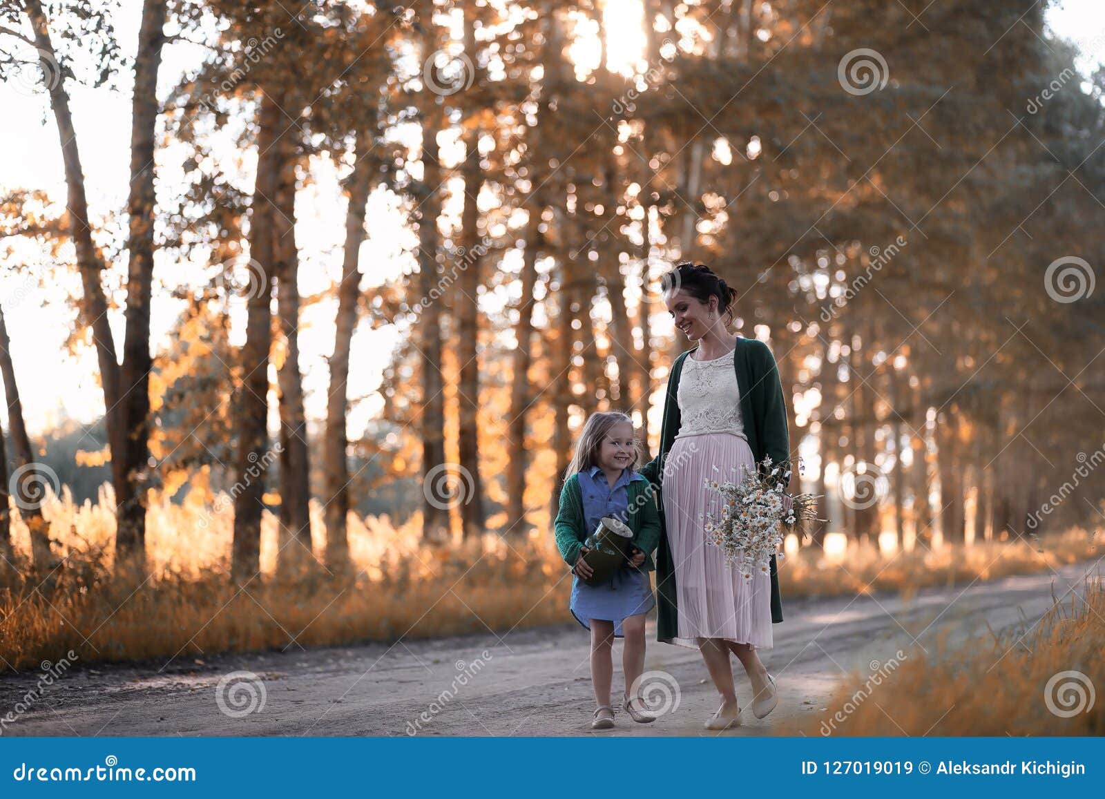The Eldest Daughter Walks Down The Flower Path Mother with Daughter Walking on a Road Stock Image - Image of happy