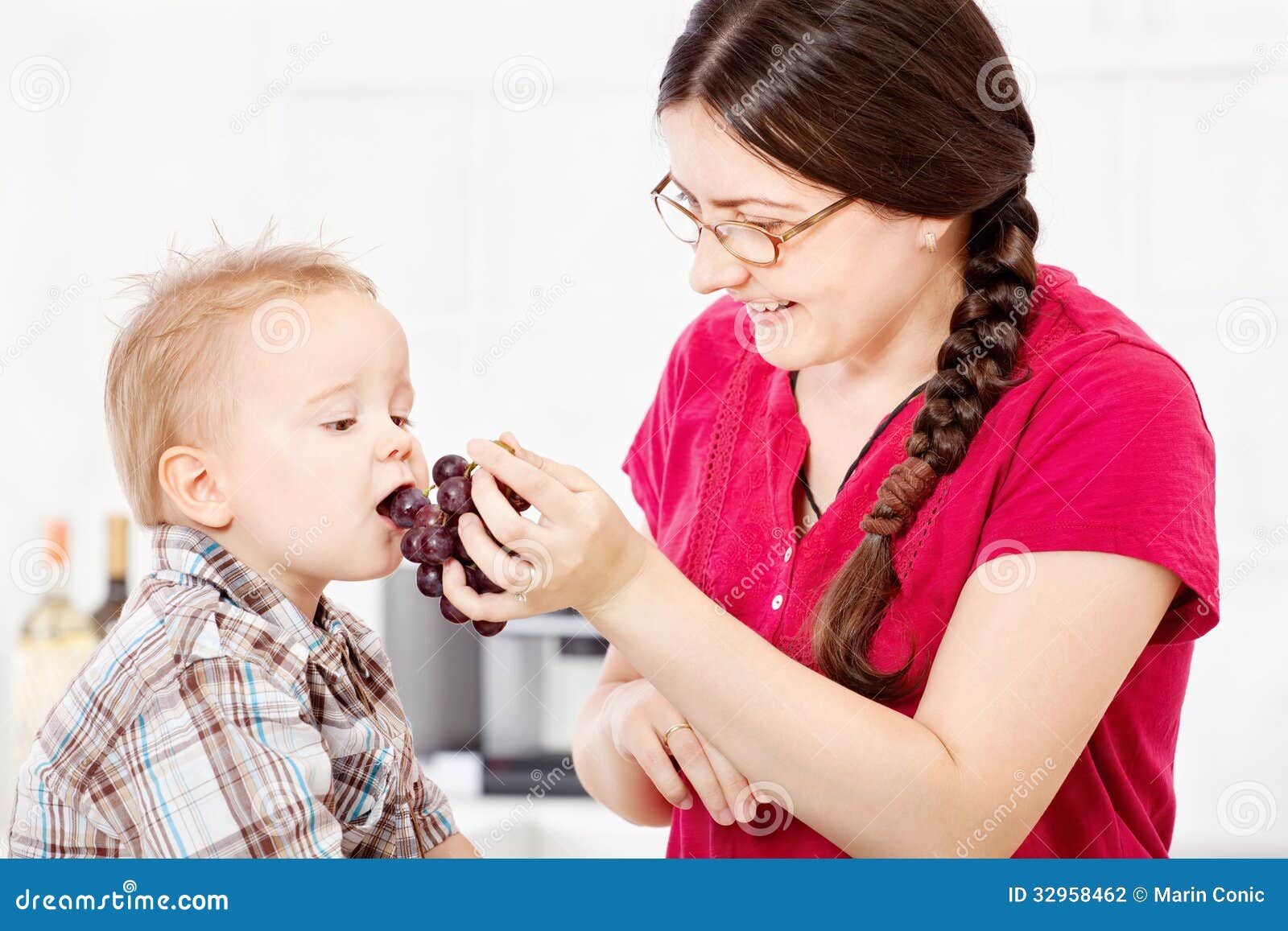 Mother Feeding Child with Grape Stock Photo Image of home, cuisine