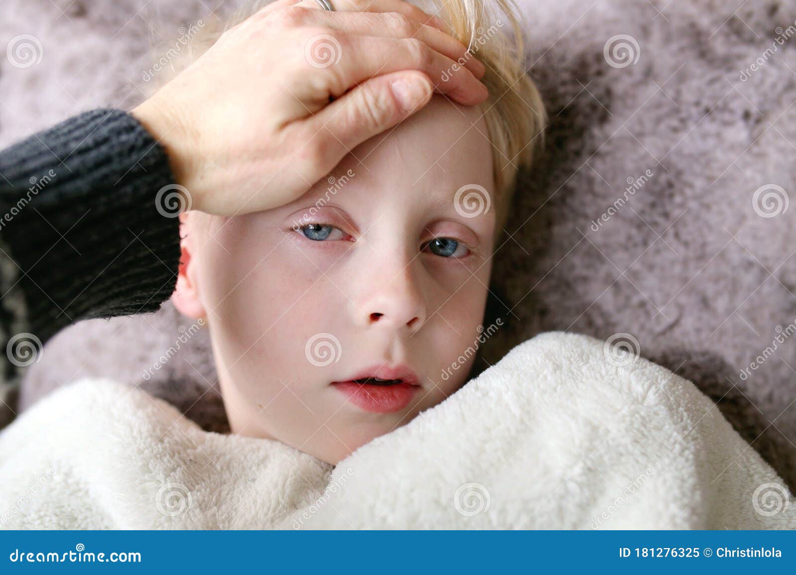 Mother Feeling Sick Young Child`s Temperature As he Rests with a ...