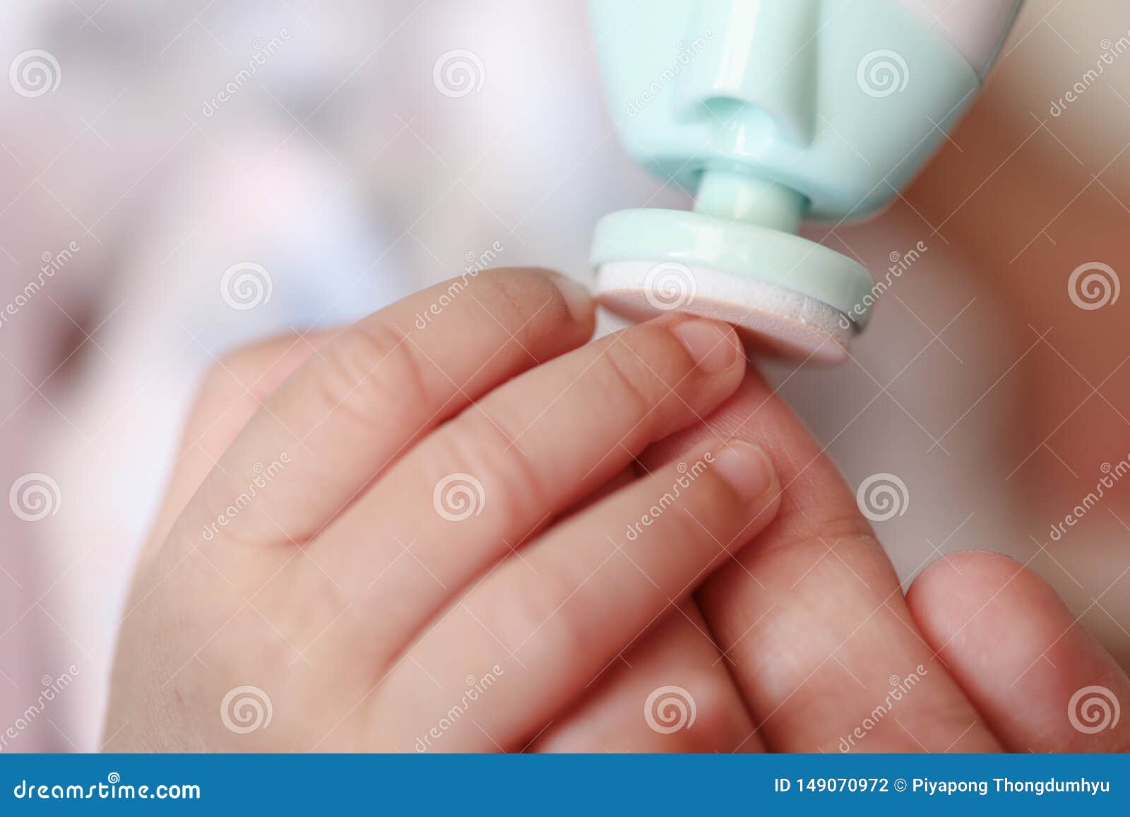 Mother Filling Baby Nails Using Automatic Baby Nail File Machine. Stock  Photo - Image of hand, drill: 149070972