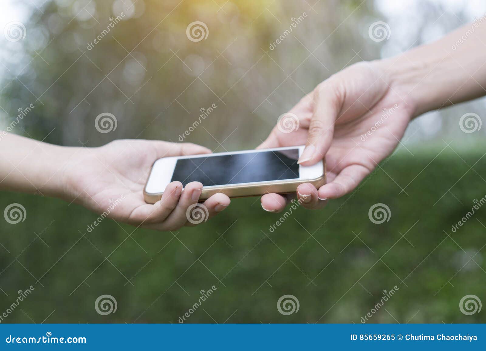 A Mother Giving Her Child a Mobile Phone Stock Image Image of concept