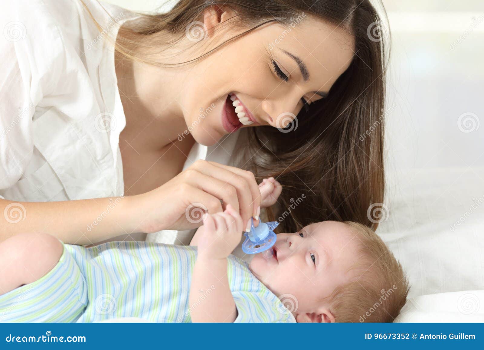 giving a newborn a pacifier