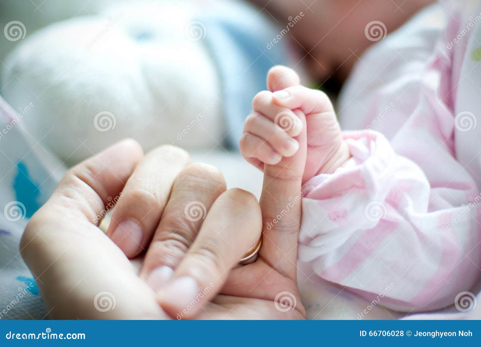 mother hand holding the baby. photo taken in the neonatal gynecological
