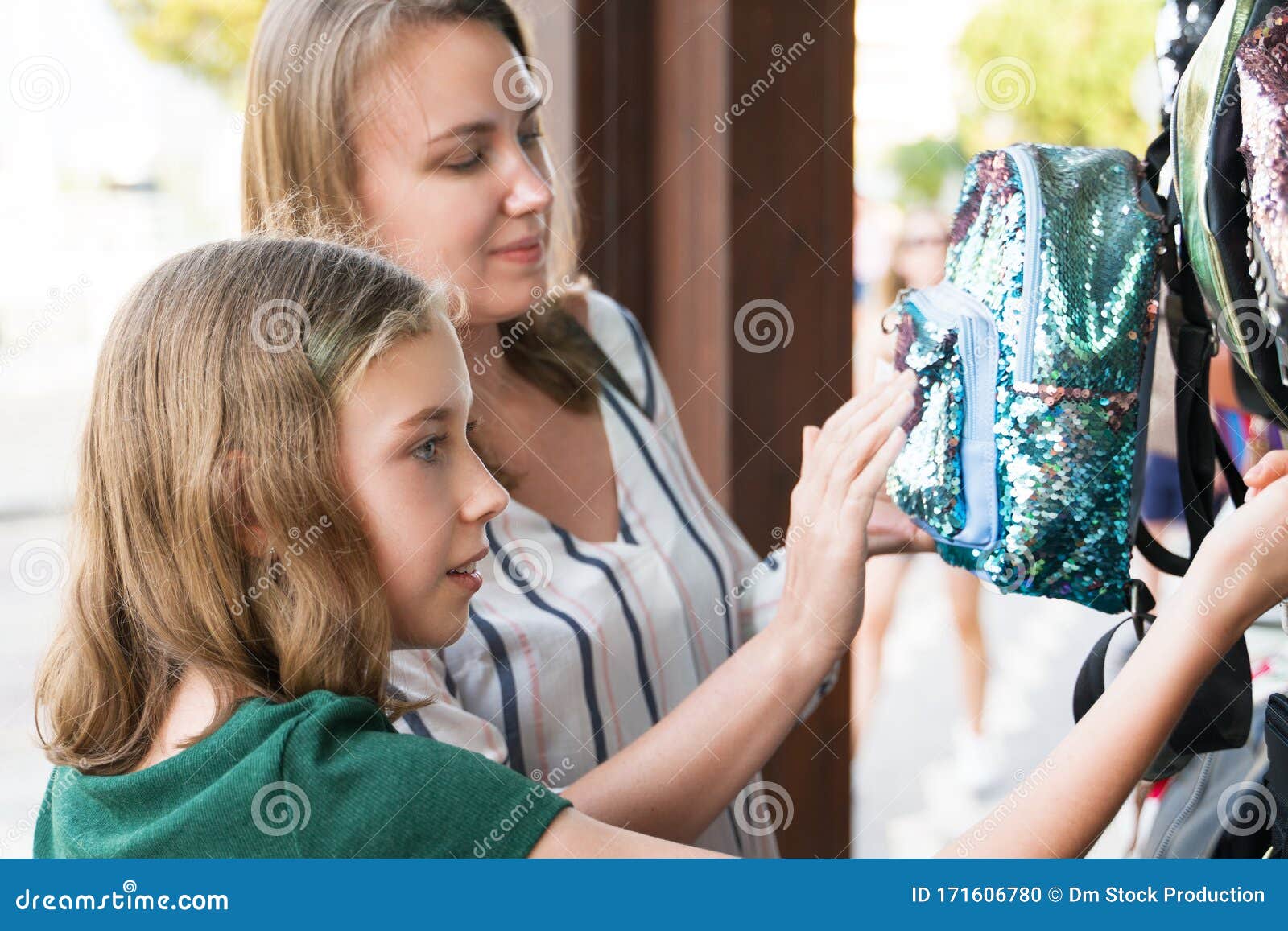 Mother and Her Daughter Choosing Backpack Stock Photo Image of person
