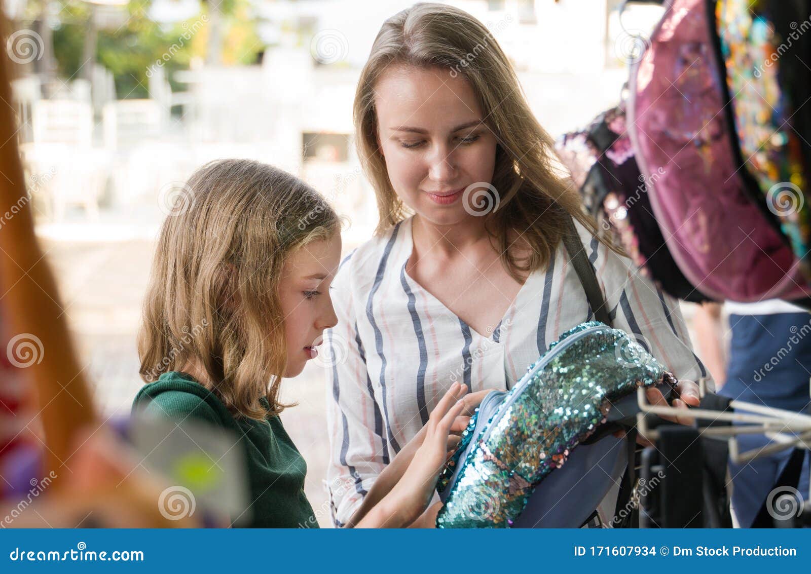 Mother and Her Daughter Choosing Backpack in Shop Stock Photo Image