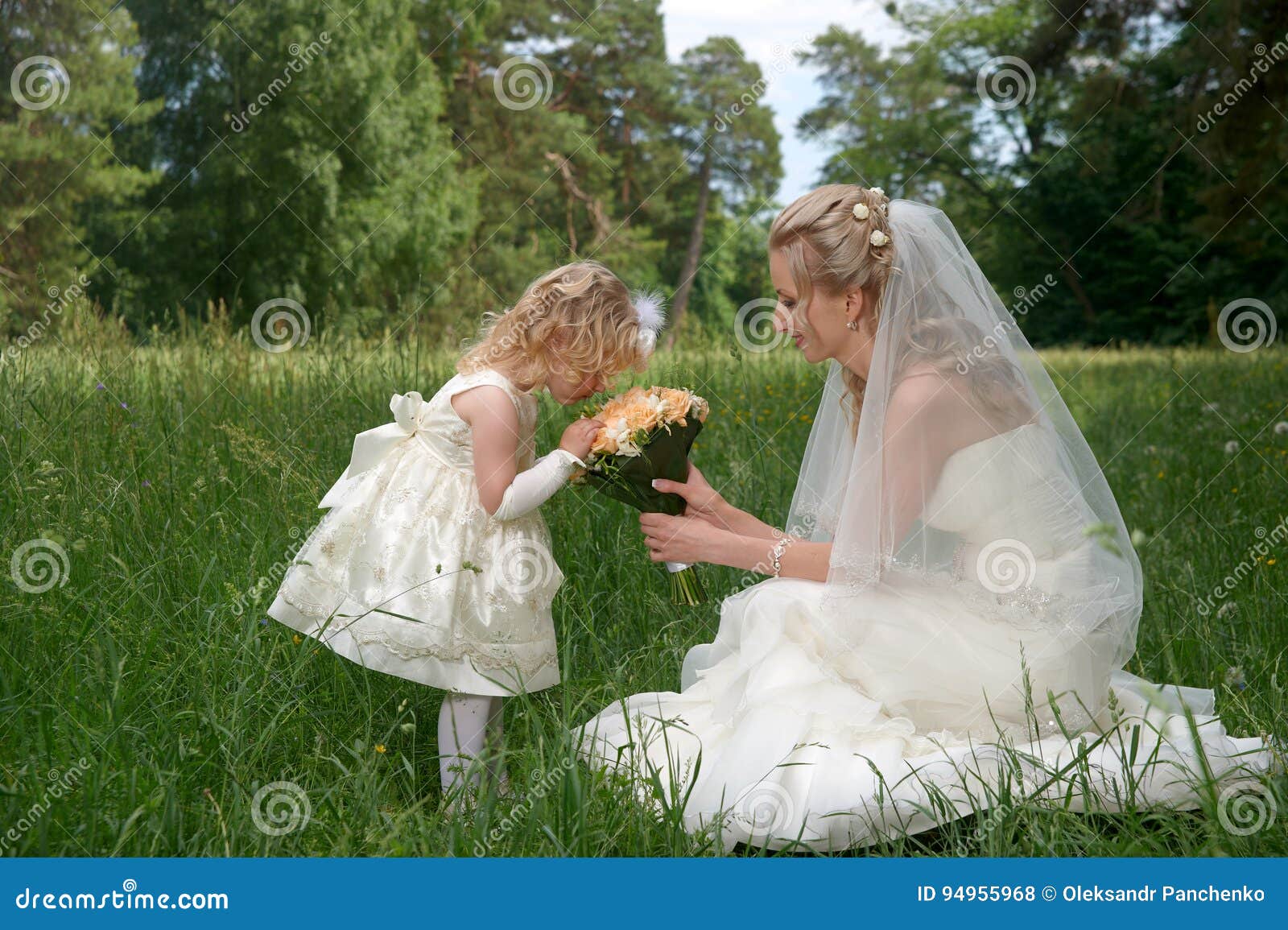 Mother in Her Wedding Dress Holding a ...