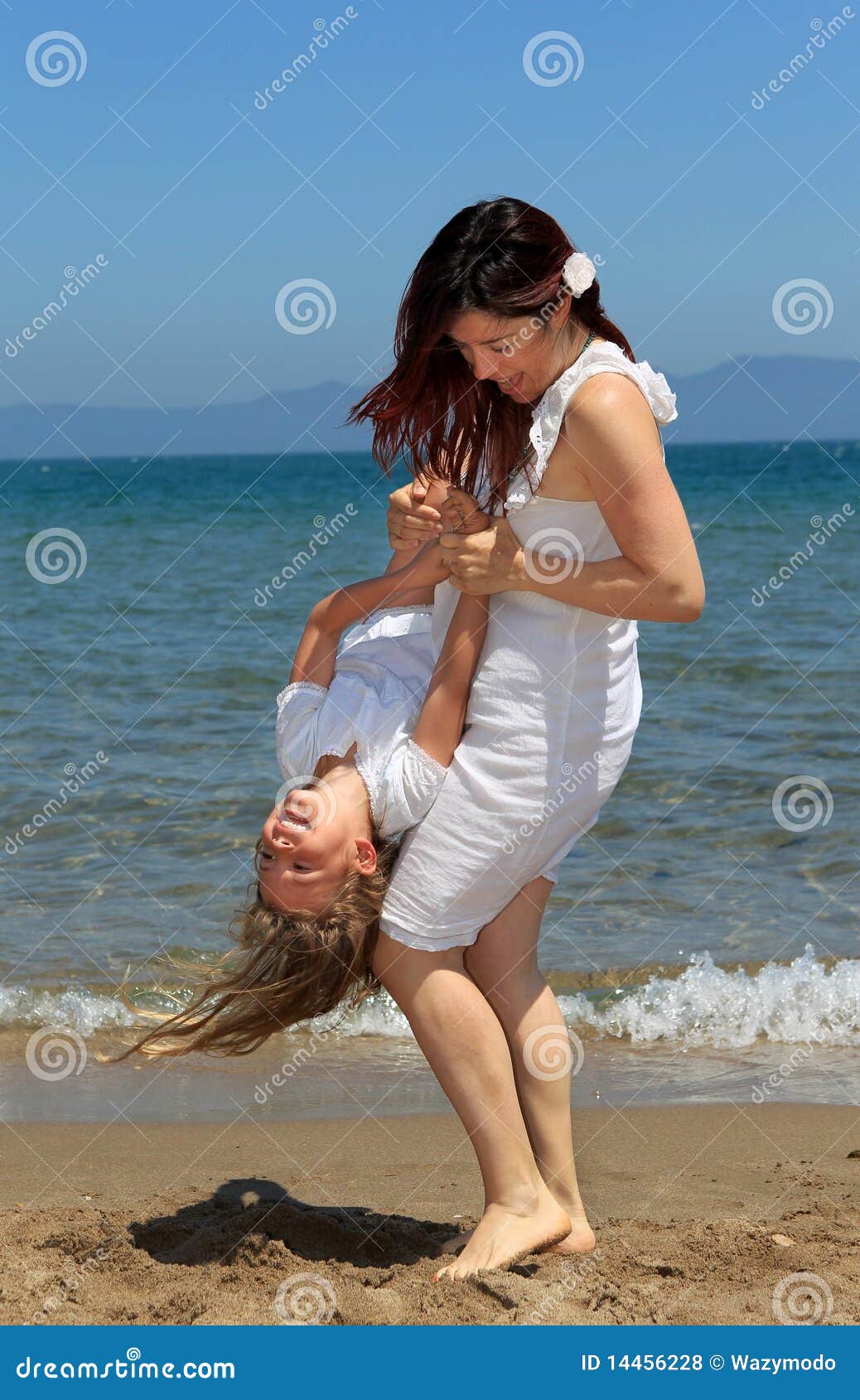 Mother Holding Daughter Upside Down Stock Photo Image of female