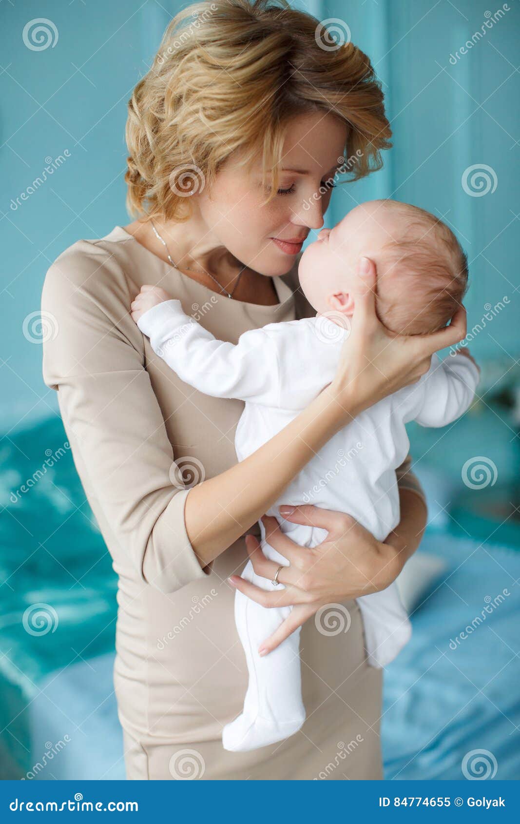 Mother Holding A Baby In Her Arms Stock Image - Image 