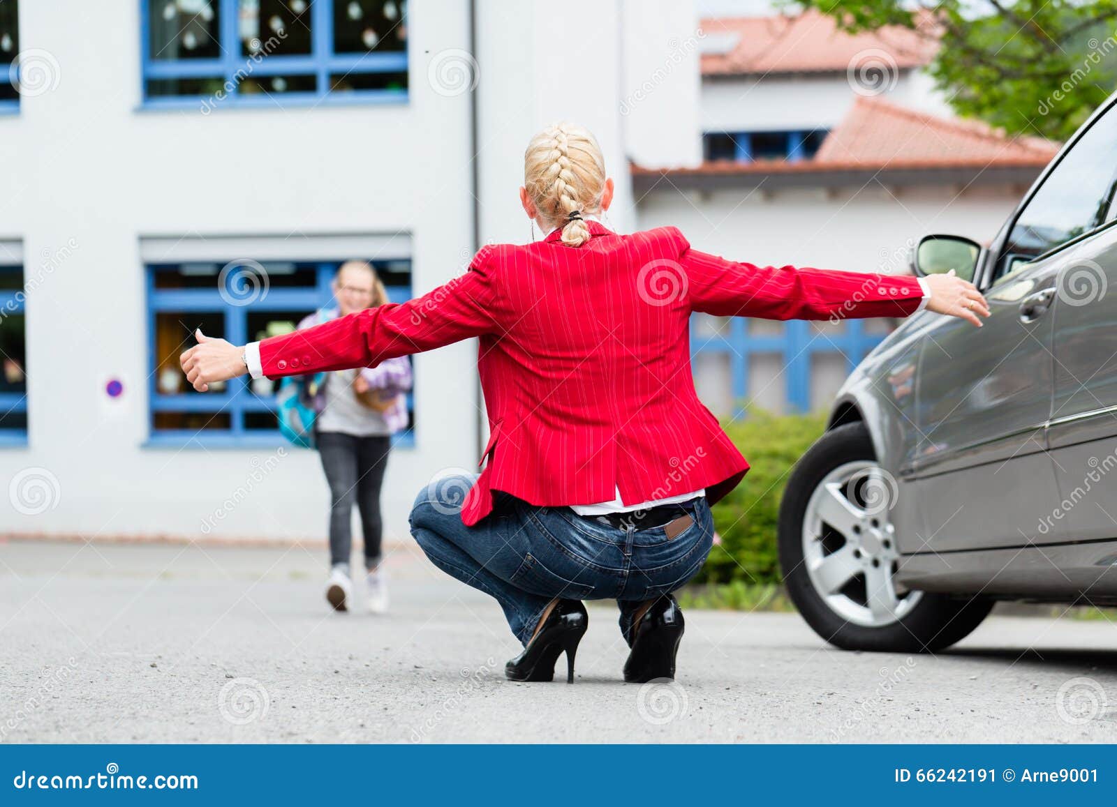 mother hugging child after bringing her to school