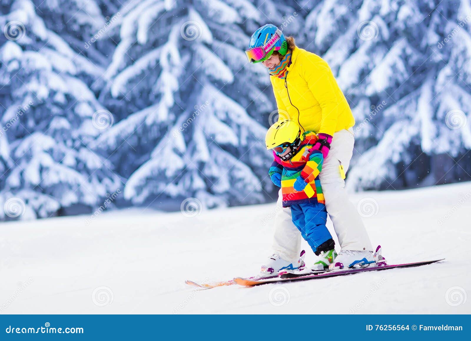 mother and little boy learning to ski