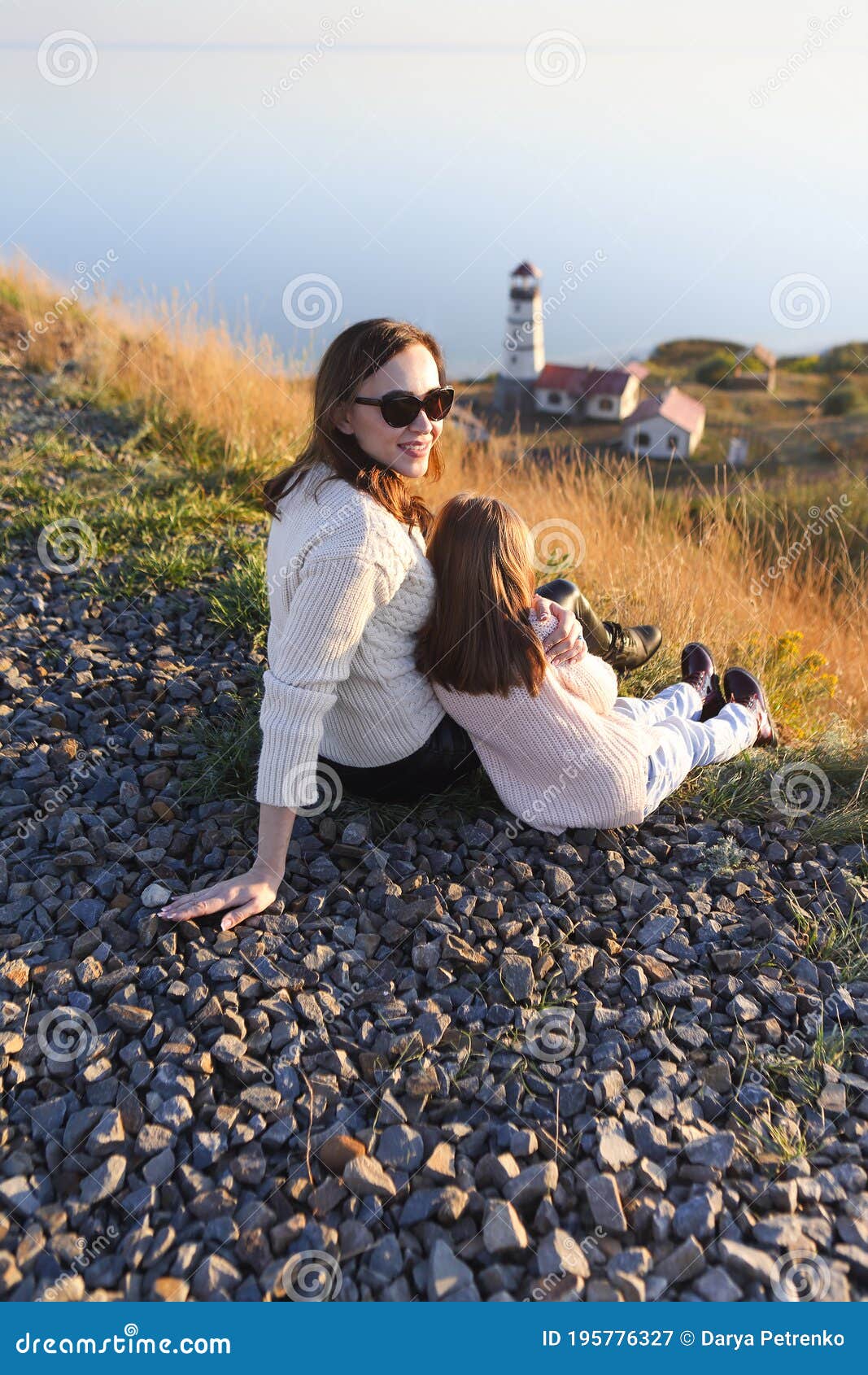 Mother and Little Daughter Dressed in Cozy Sweaters Together Near the ...