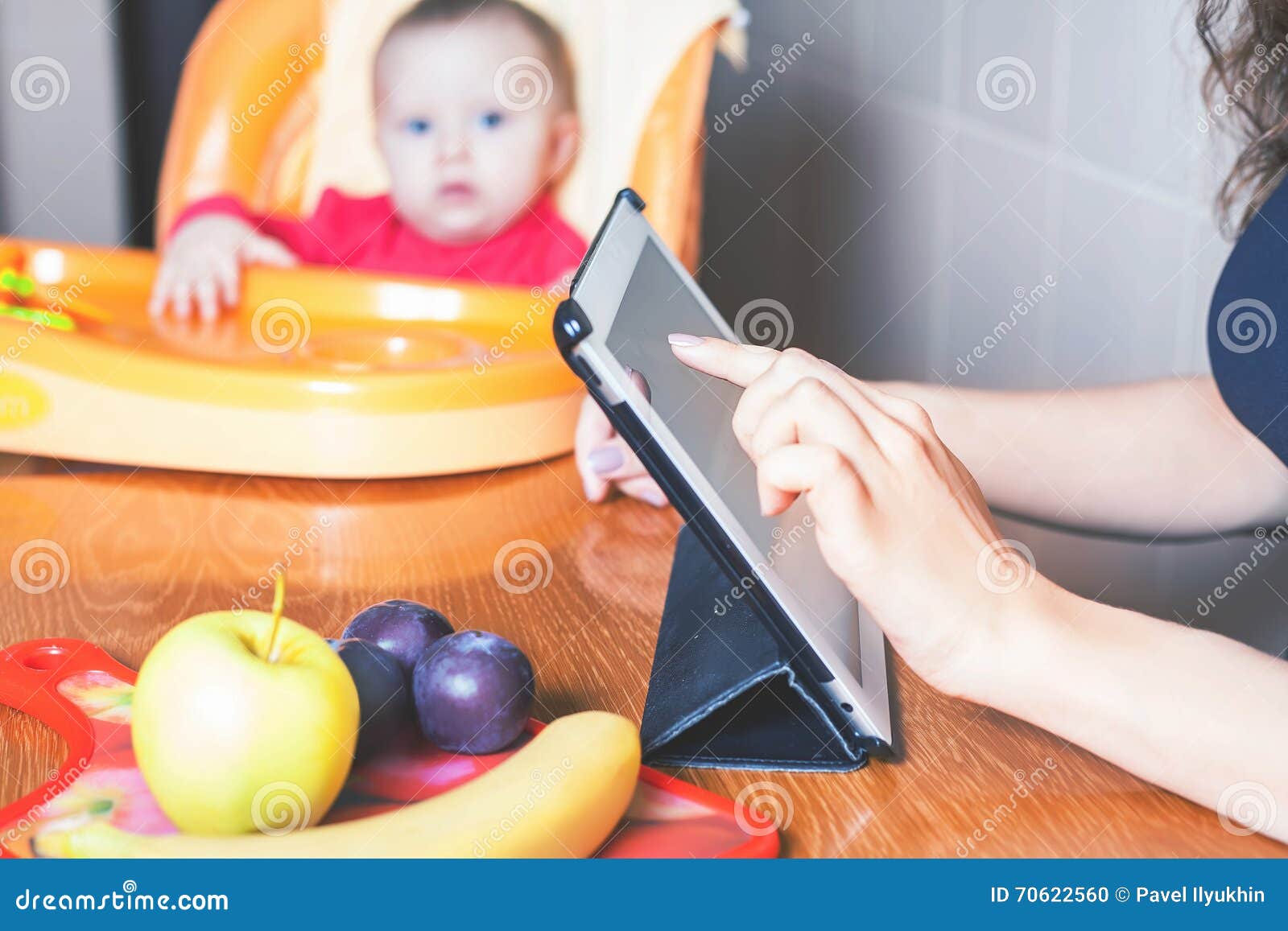 mother looking for recipe of preparation of baby food