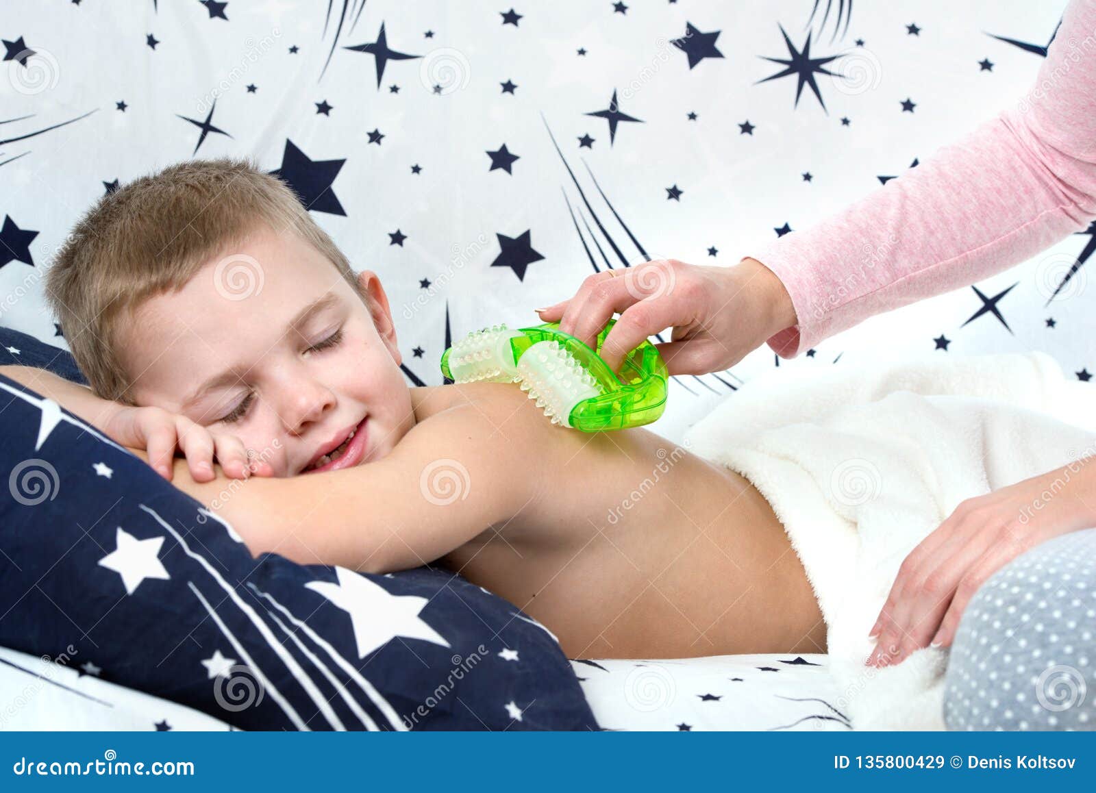 The Mother Makes The Massage Of The Back Of His Little Son Stock Image