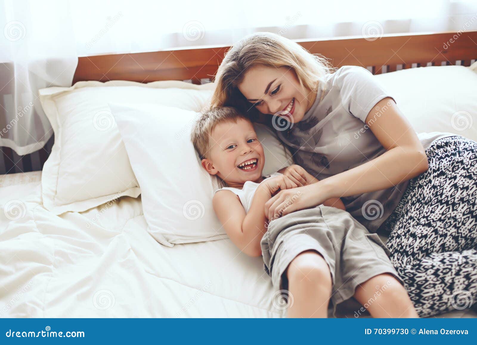Mother Plays With Son In Bed Stock Photo Image Of Child Leis