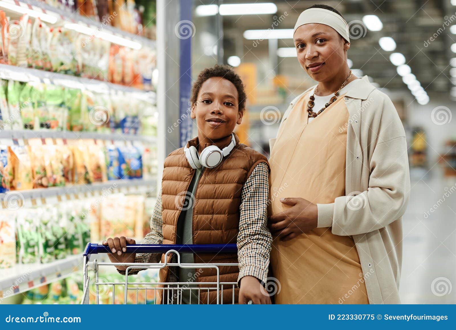 Mother Shopping with Son stock image. Image of cute - 223330775