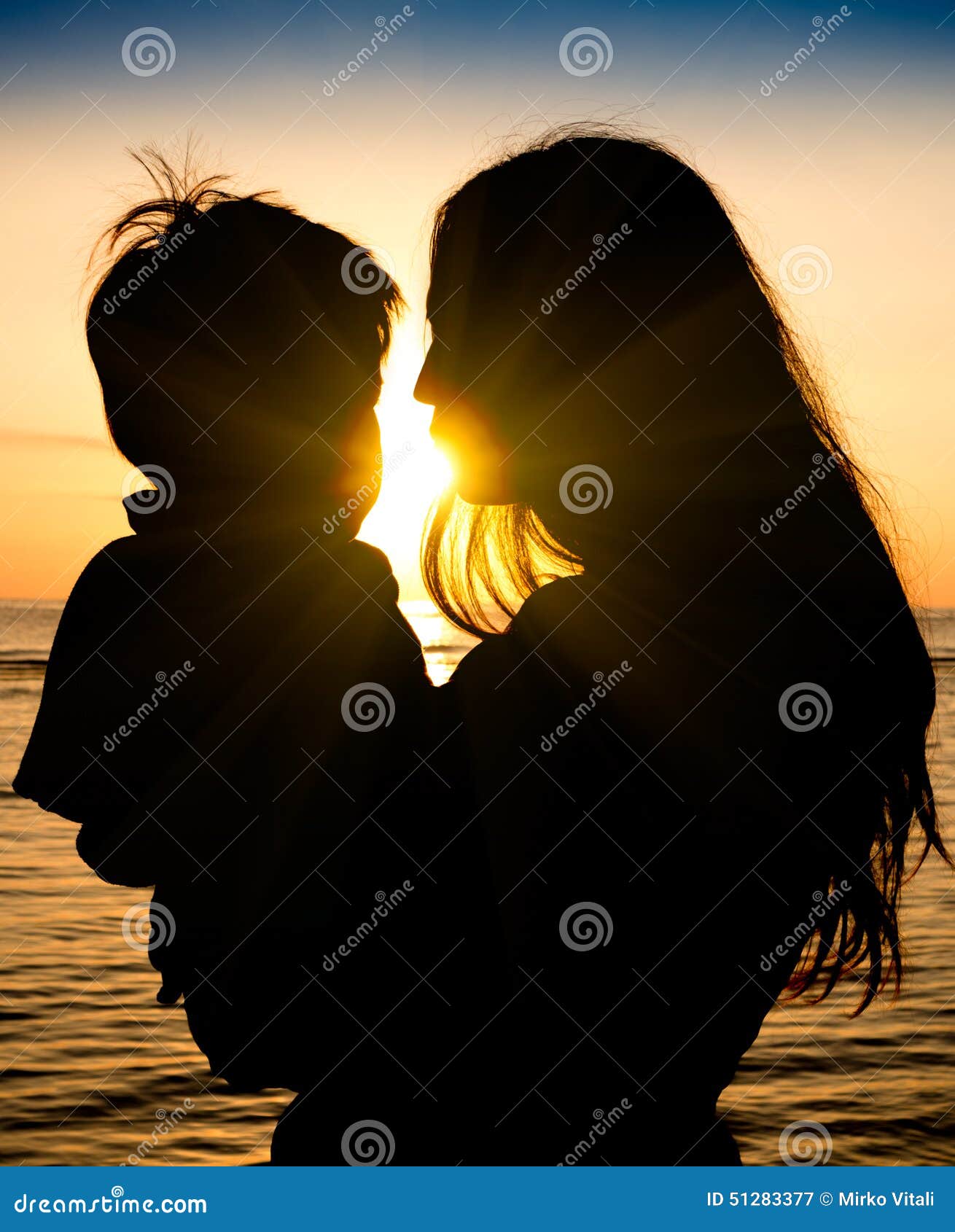Mother and Son in a Deep Moment of Love during Sunset at Beach ...