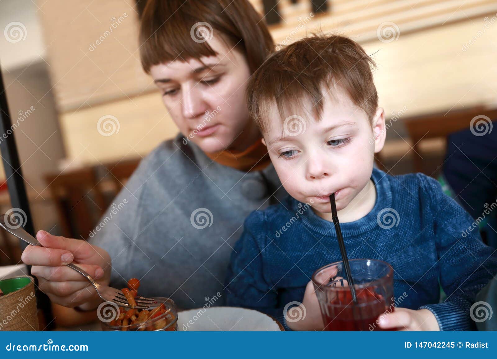 Mother with son have lunch stock image. Image of food - 147042245