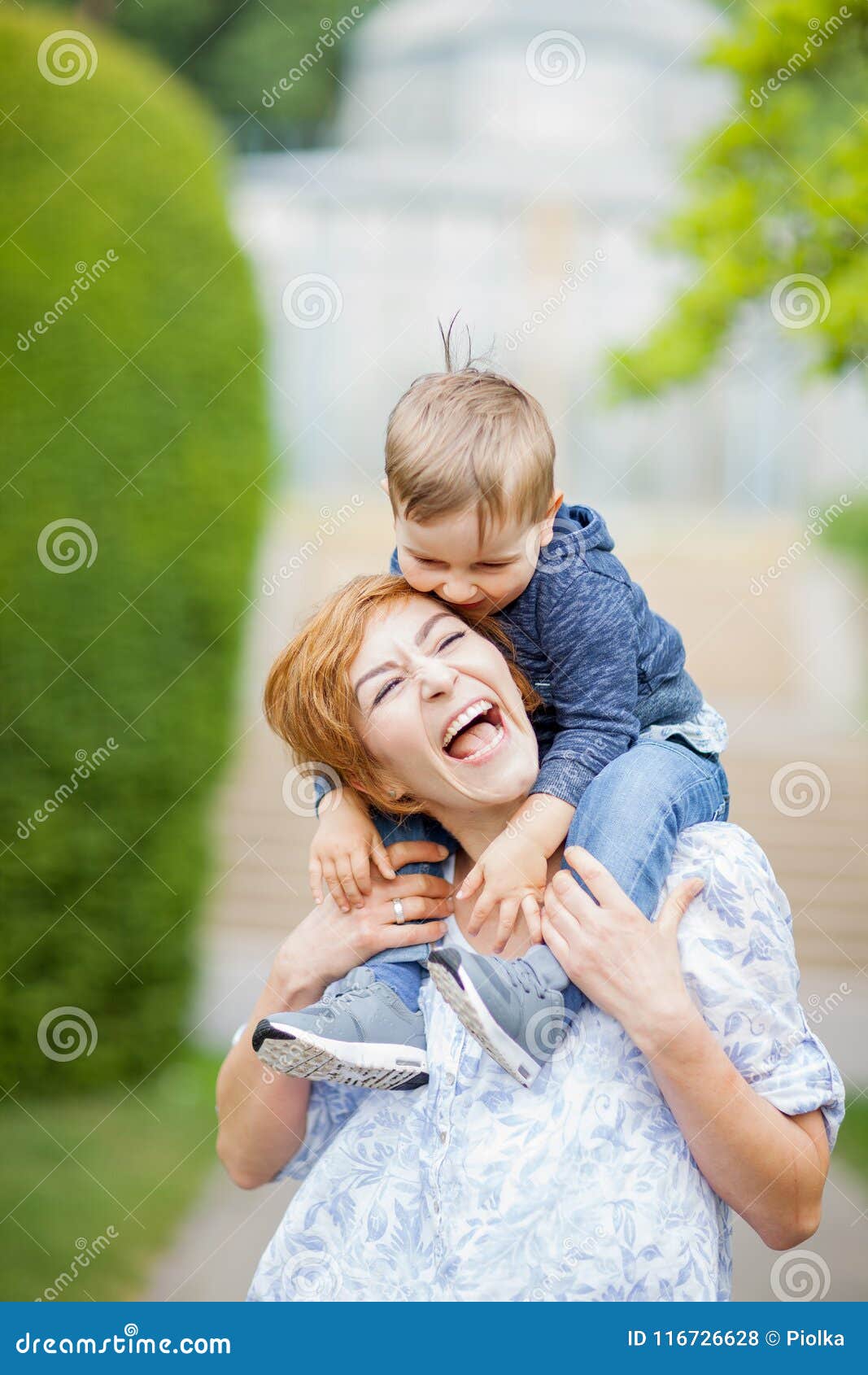 mother and son having fun together, giggle, happy and smiling