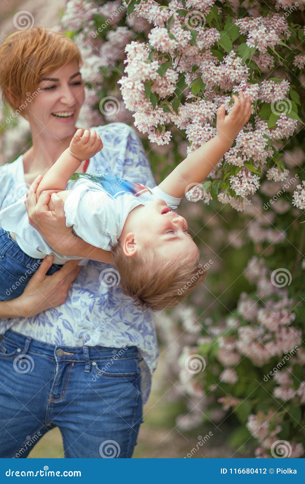 mother and son having fun together, giggle, happy and smiling