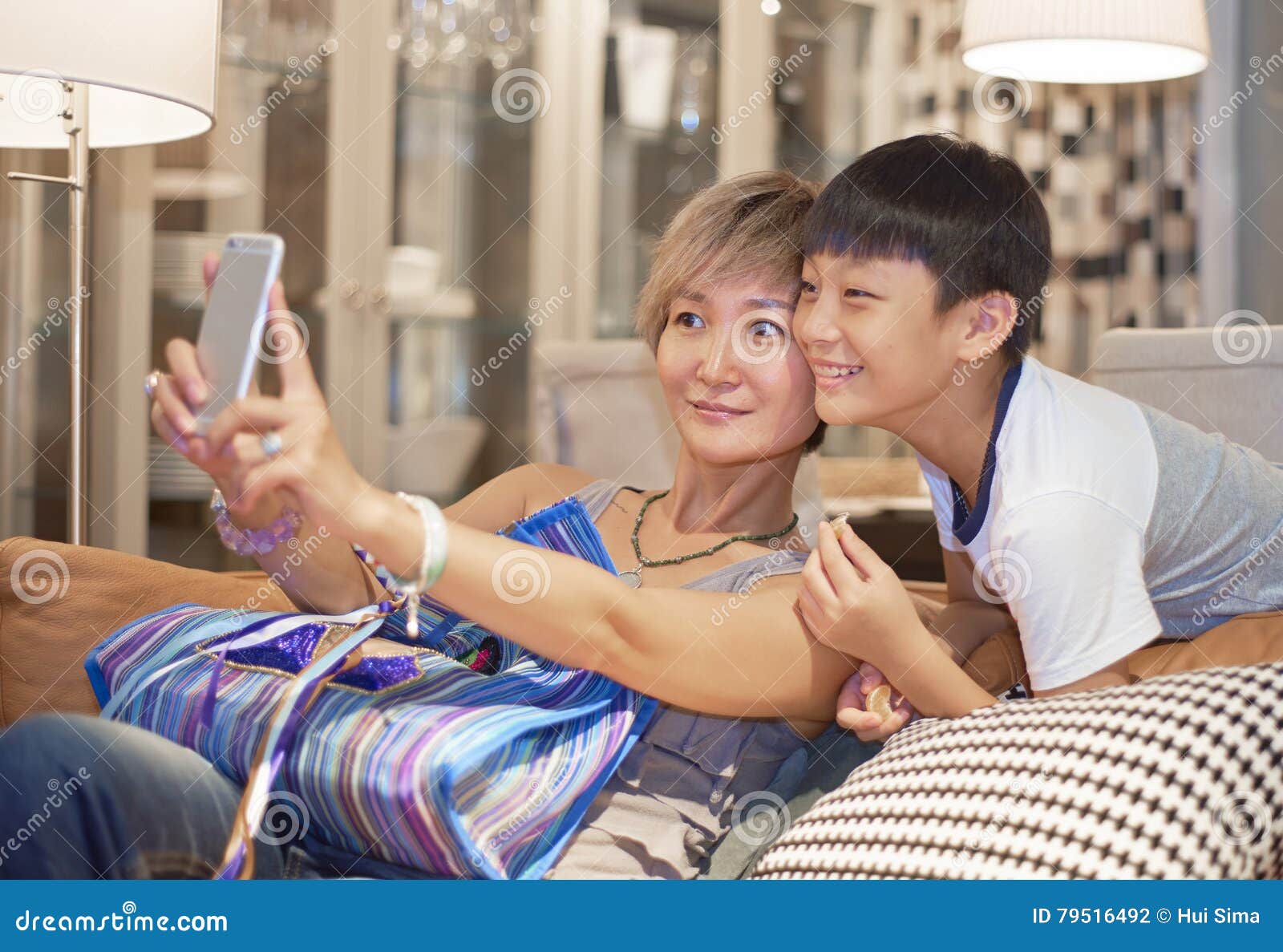 Mother And Son Posing For Selfie On Sofa Stock Photo Image Of