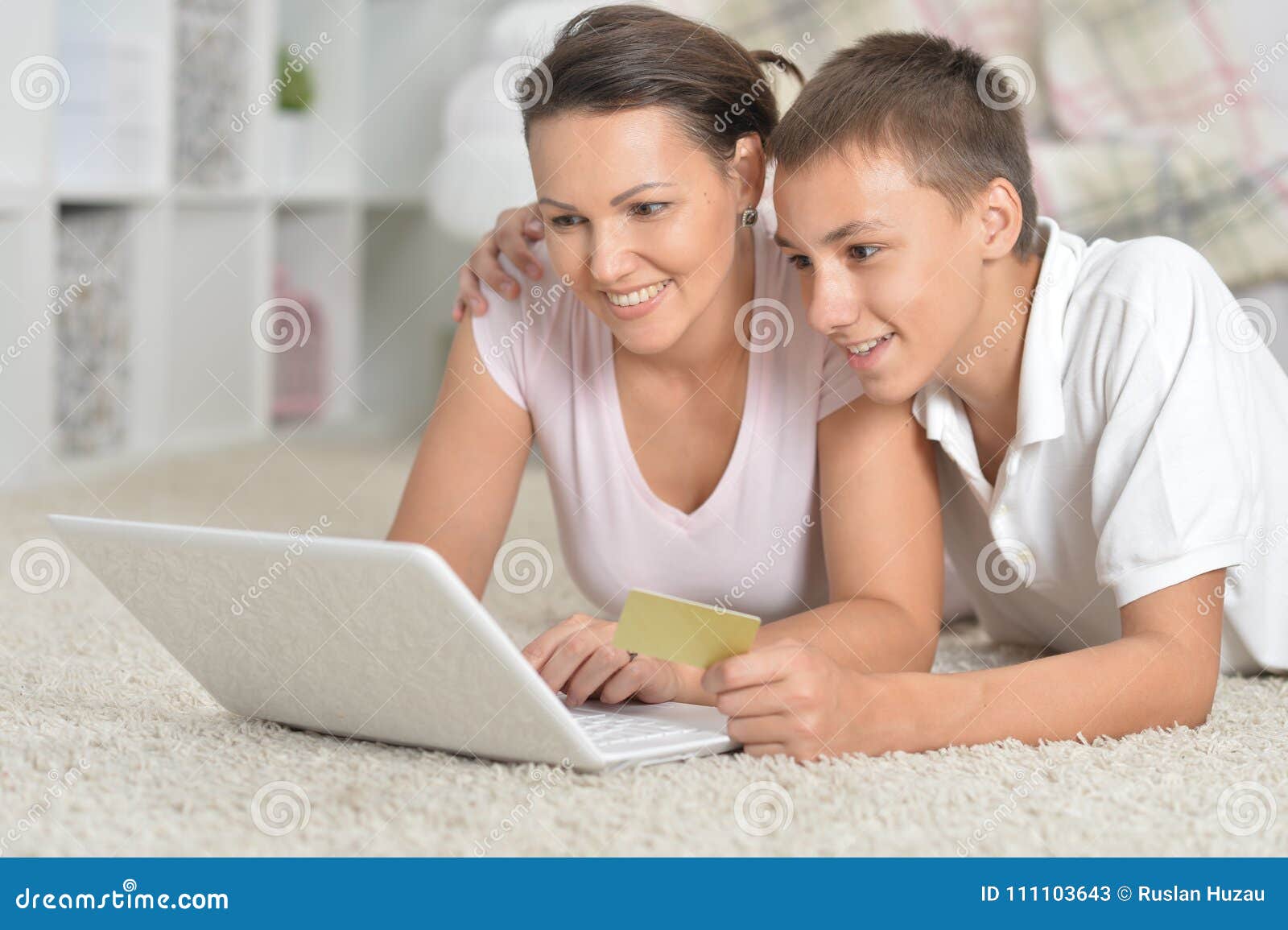 mother and son using laptop