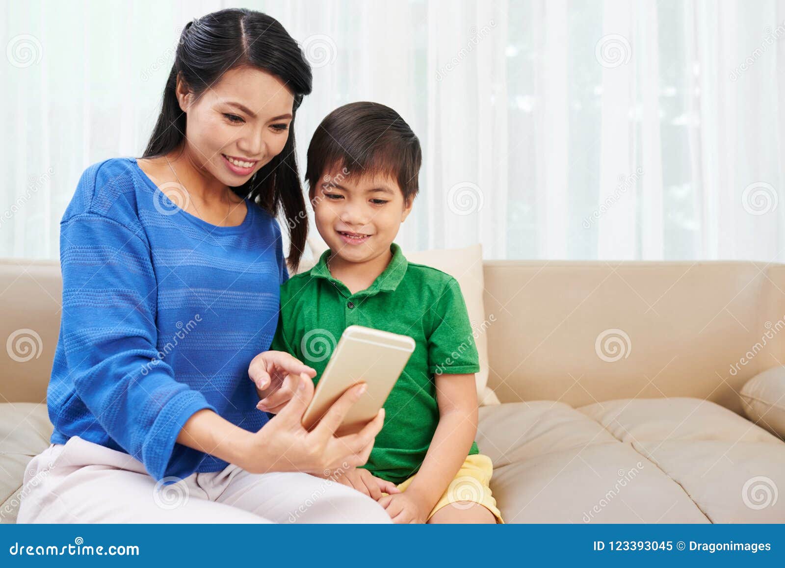 Mother And Son Using Smartphone Stock Image Image Of Lifestyle