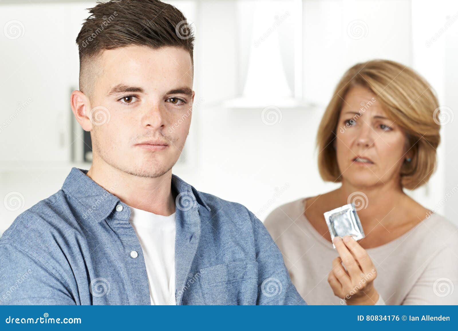 Mother Talking To Teenage Son About Contraception Stock