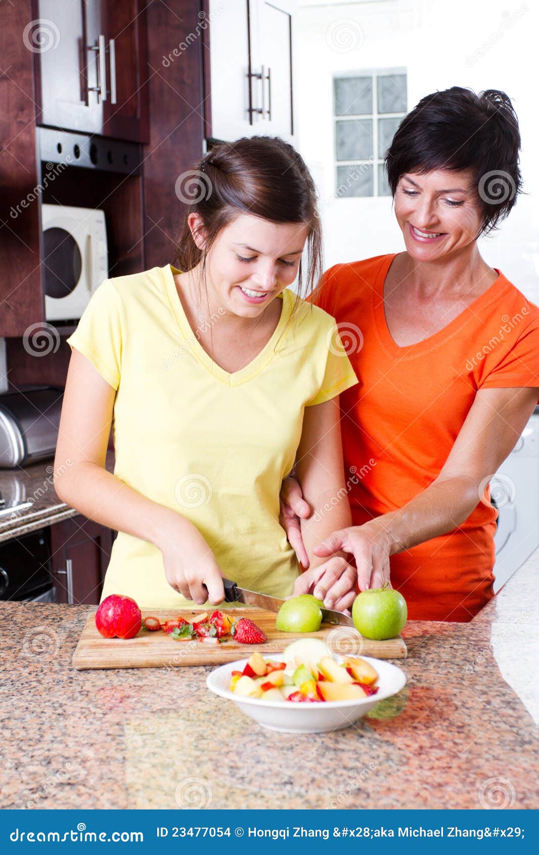 Mother Teaching Daughter Cooking
