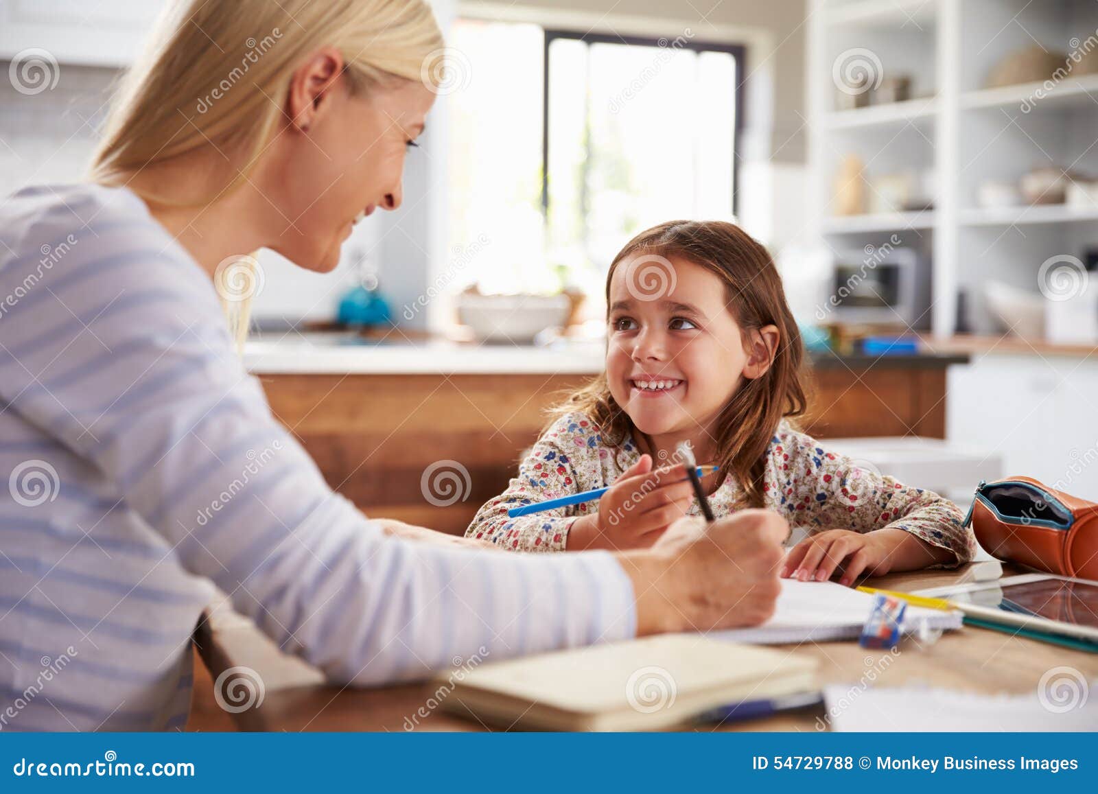 Mother Teaching Daughter How To Write Letters Royalty Free Stock Image