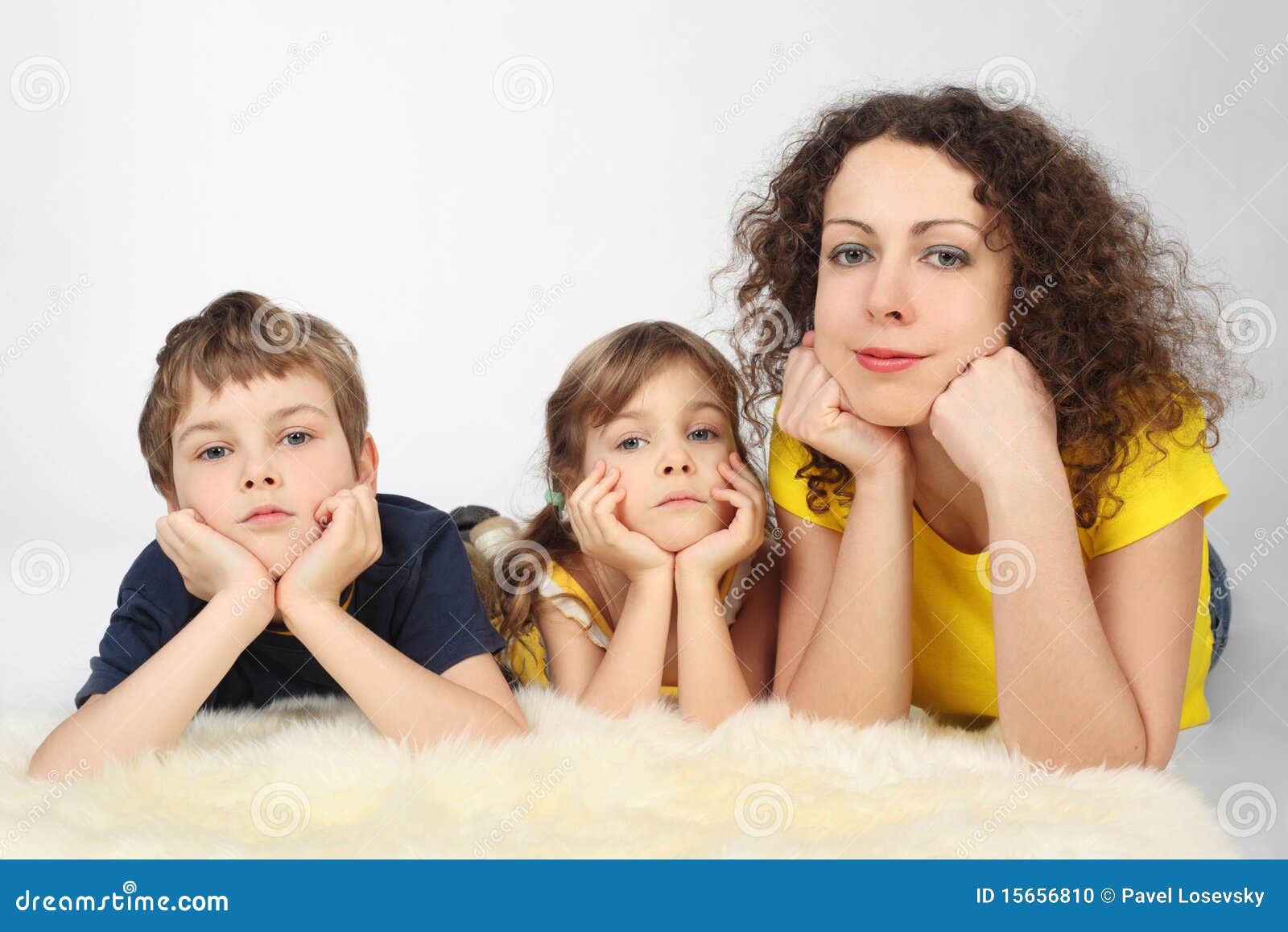 mother with two serious children lies on fell