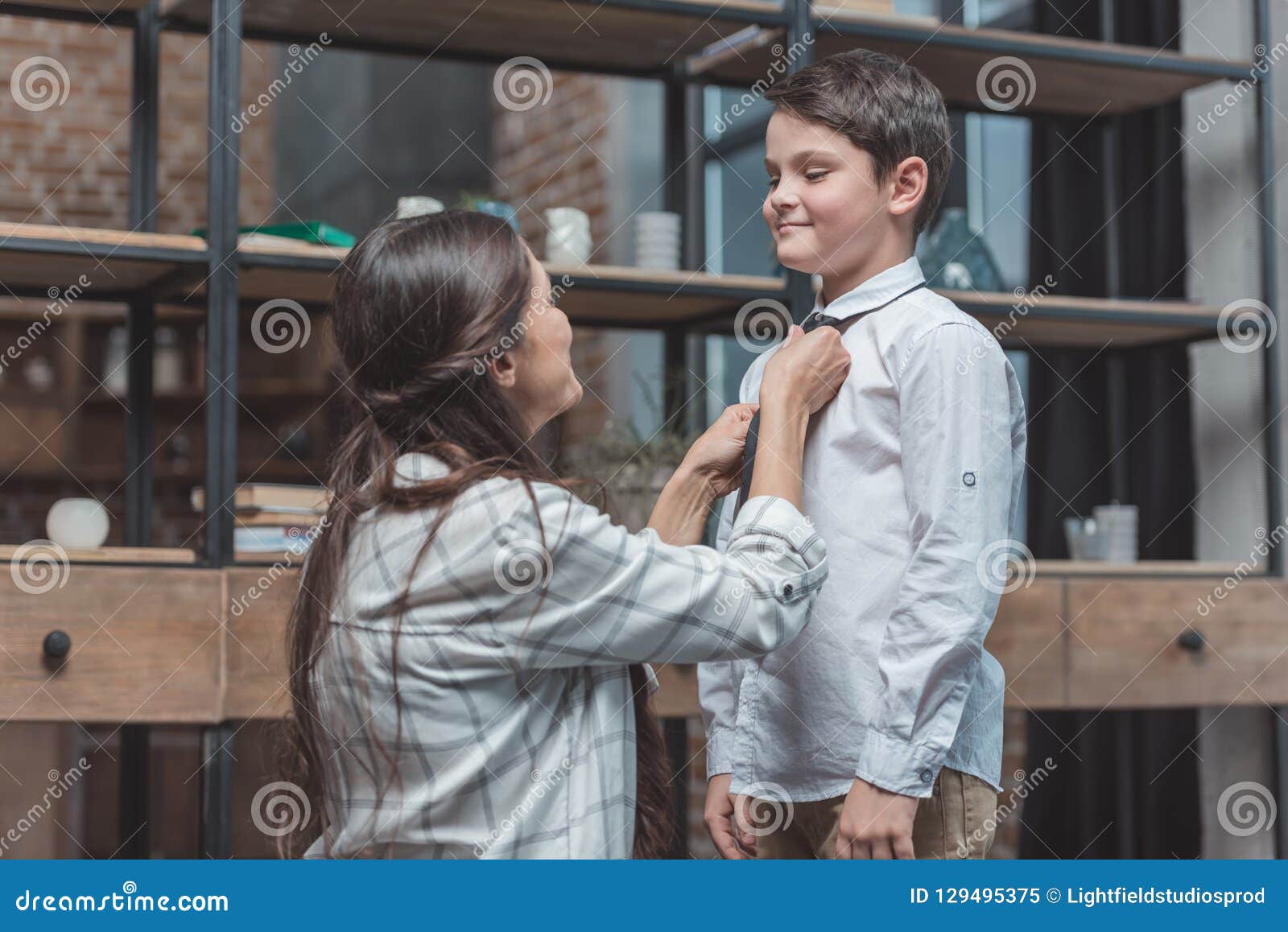 Mother Helping Her Little Son Get Dressed And Tie Stock Image Imag