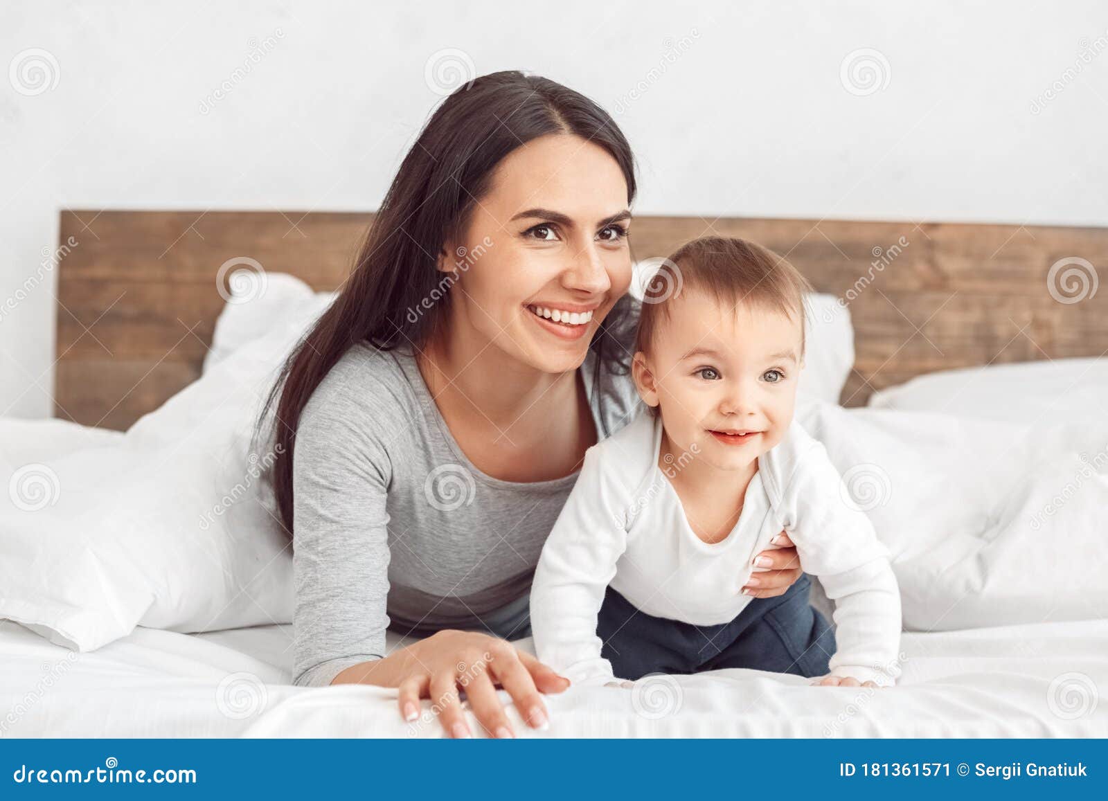 Motherhood. Mother and Son Lying on Bed Smiling Playful Stock Image ...