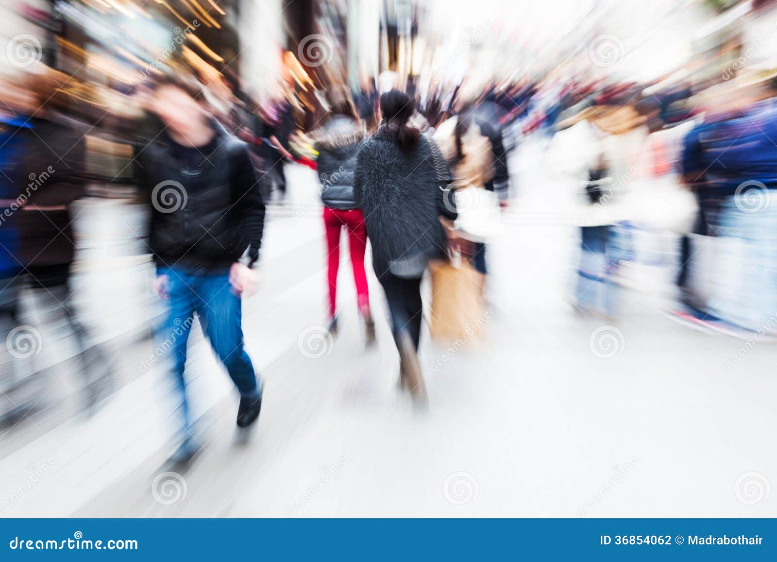 Motion blur people walking pass door of old building in rush hour  representing urban life Stock Photo - Alamy