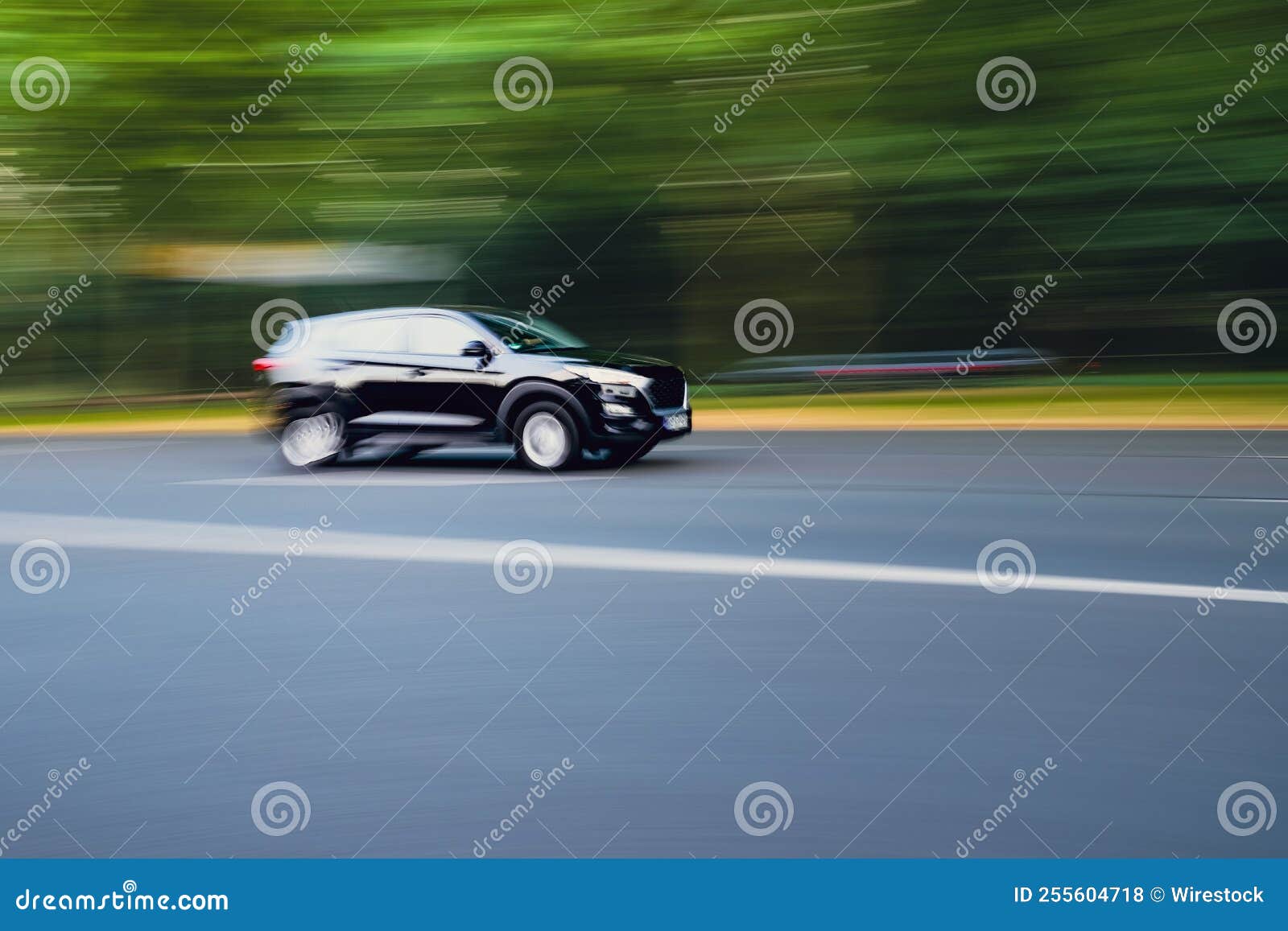 Motion Blur Shot of a Car Driving Fast in a Road Stock Photo Image of