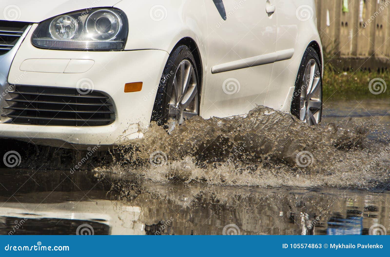 Motion Car Rain Big Puddle of Water Spray from the Wheels Editorial